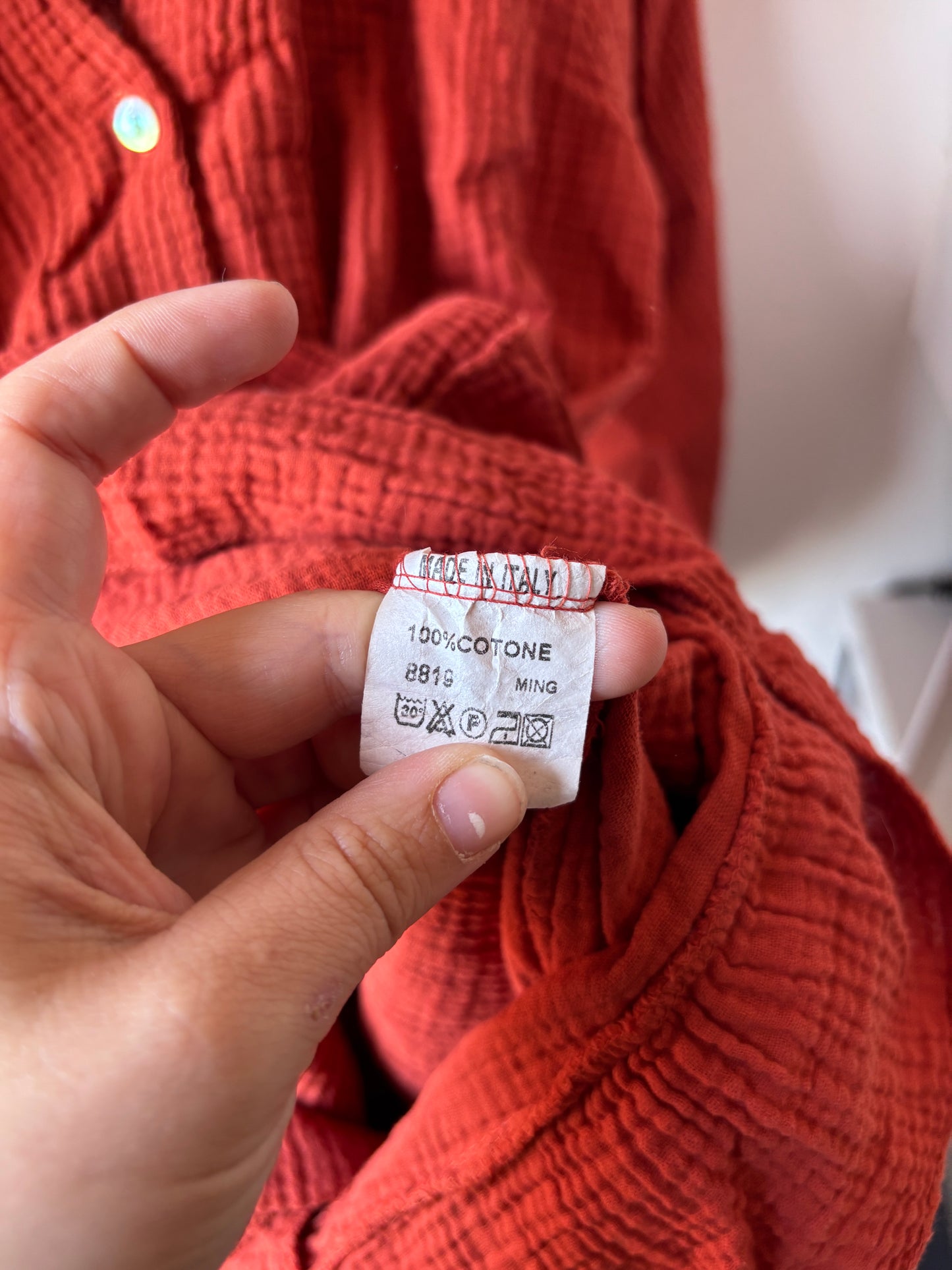 Roestkleurige playsuit met lange mouwen