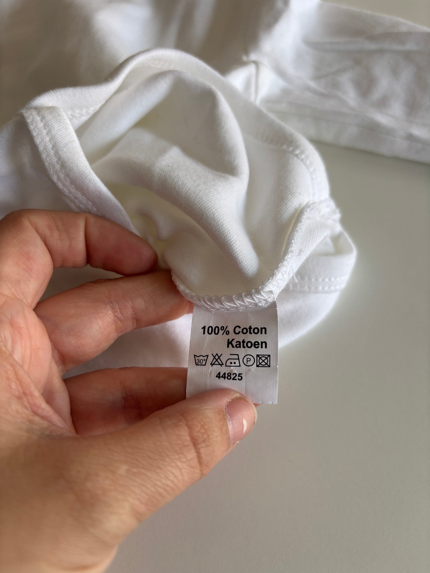 Witte romper met lange mouwen en rolkraag