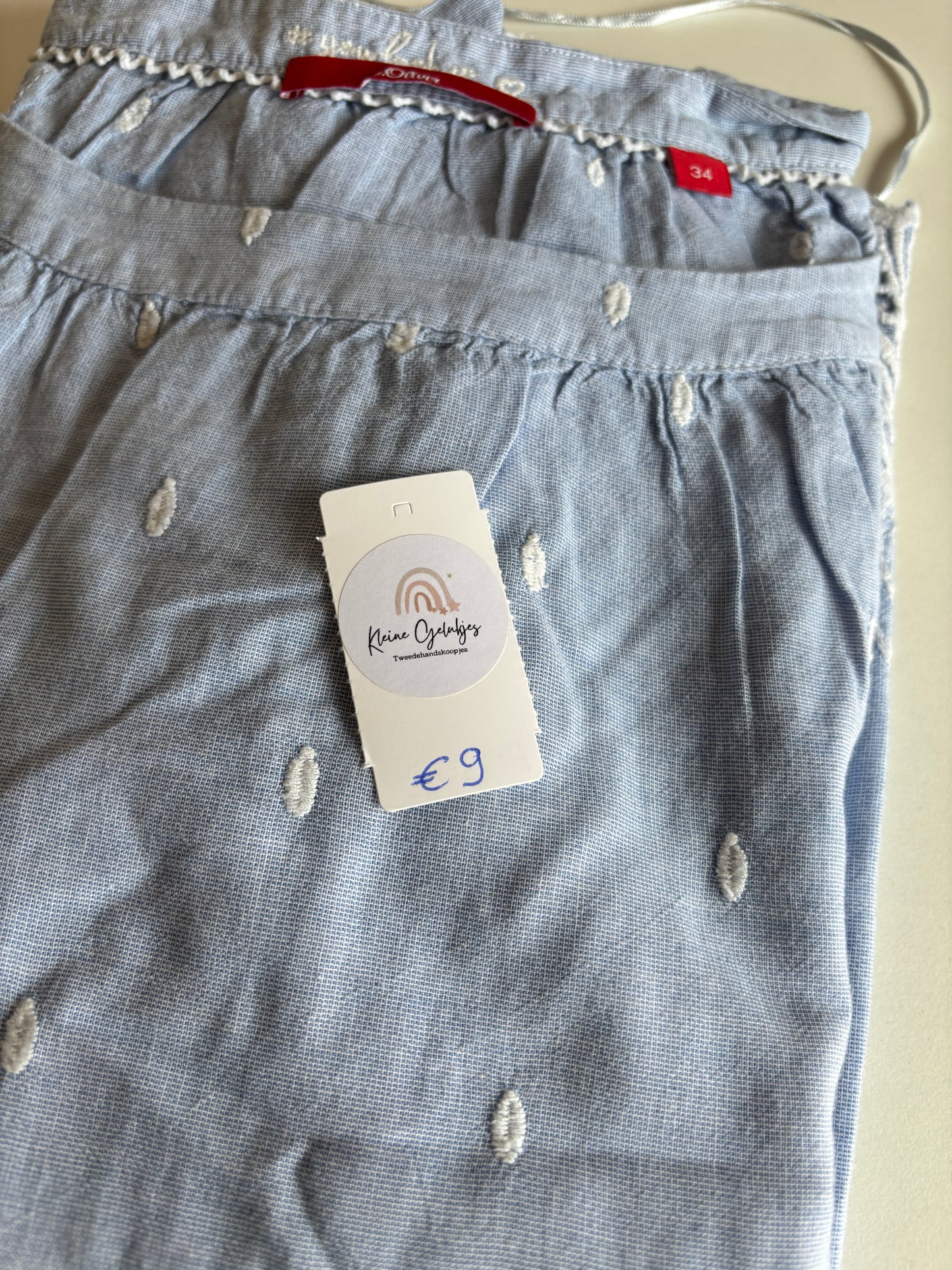 Lichtblauwe blouse met halflange mouwen