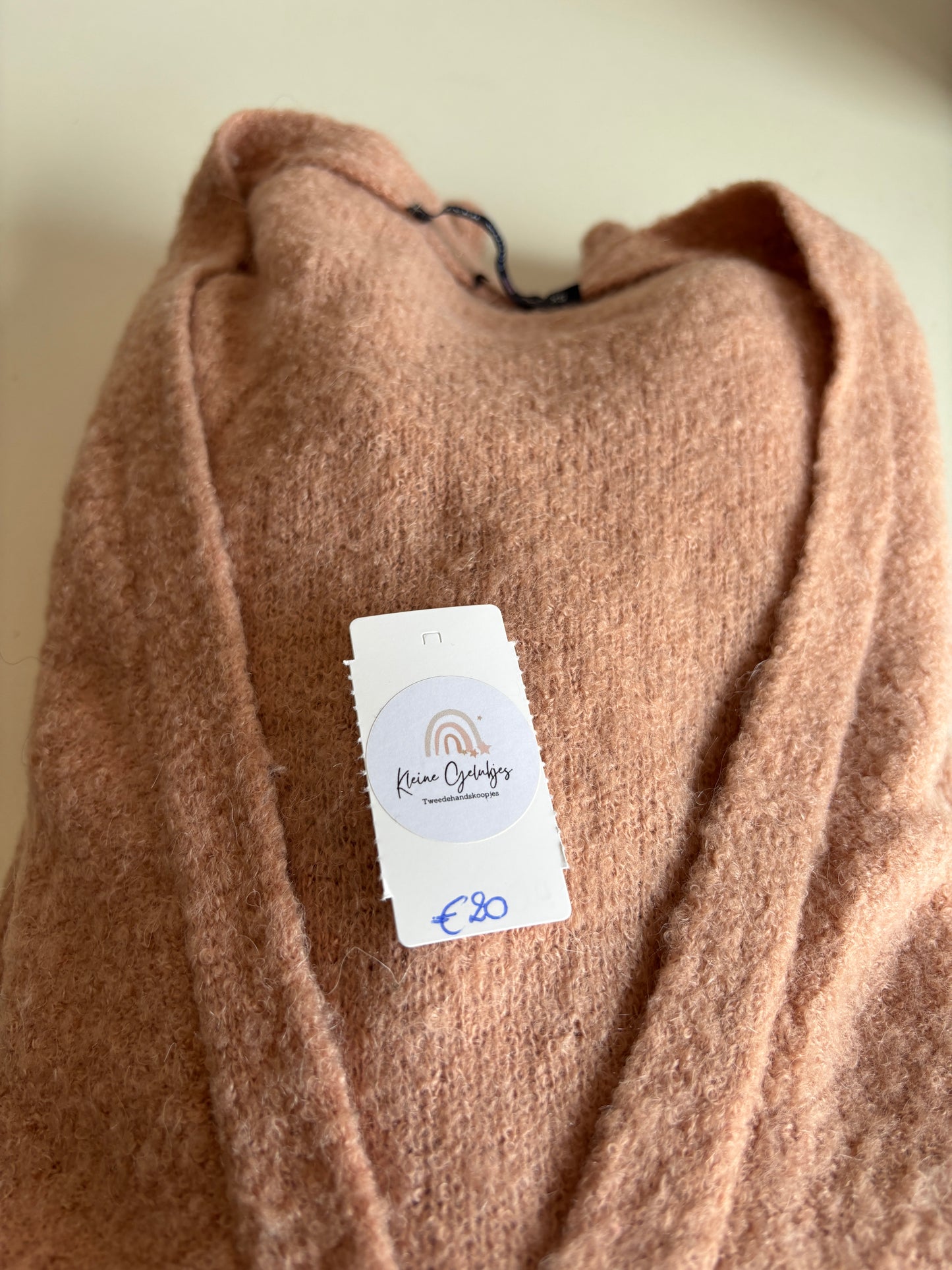 Roze vest met knoopje