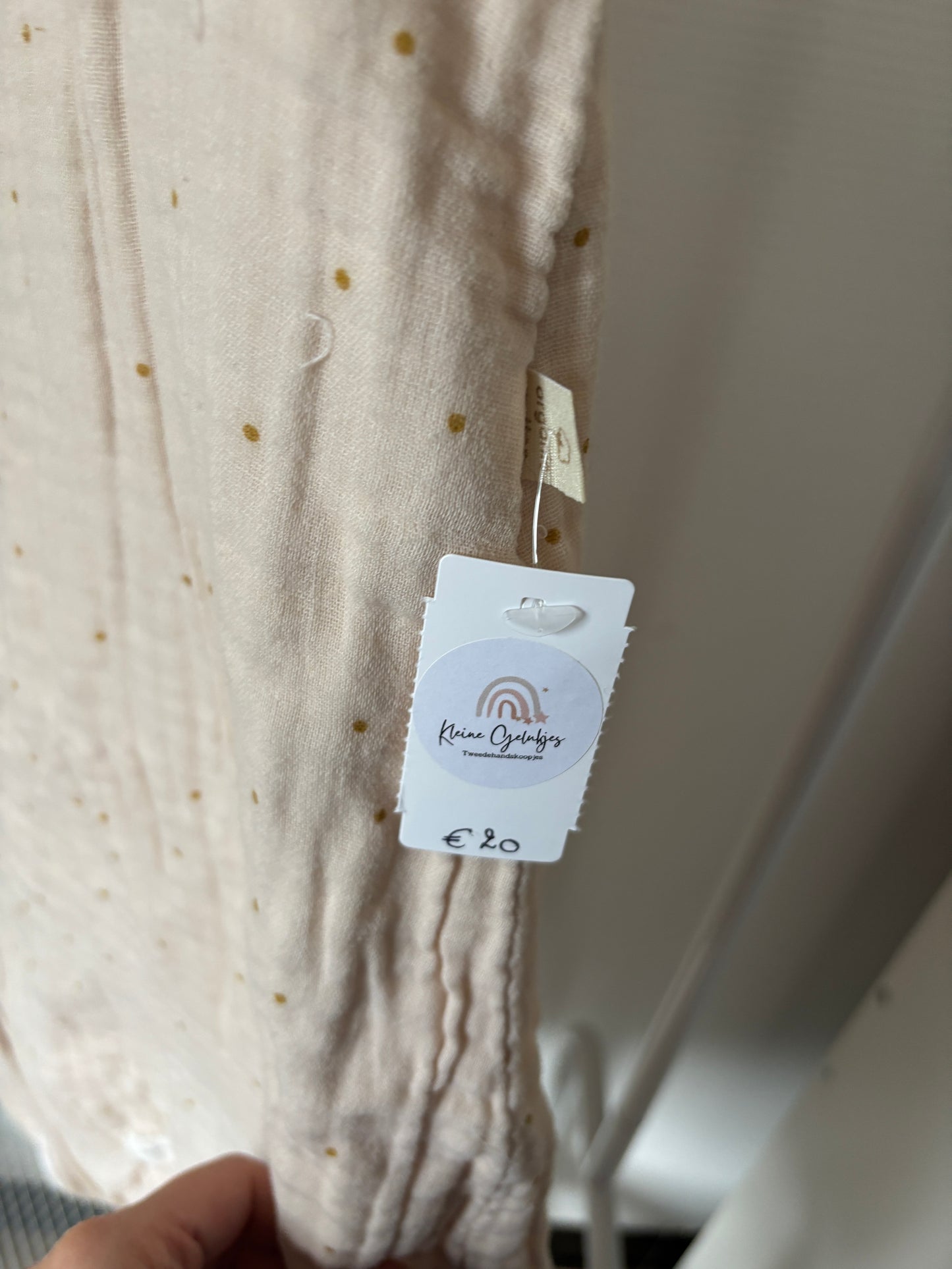 Gestippelde crèmekleurige slaapzak