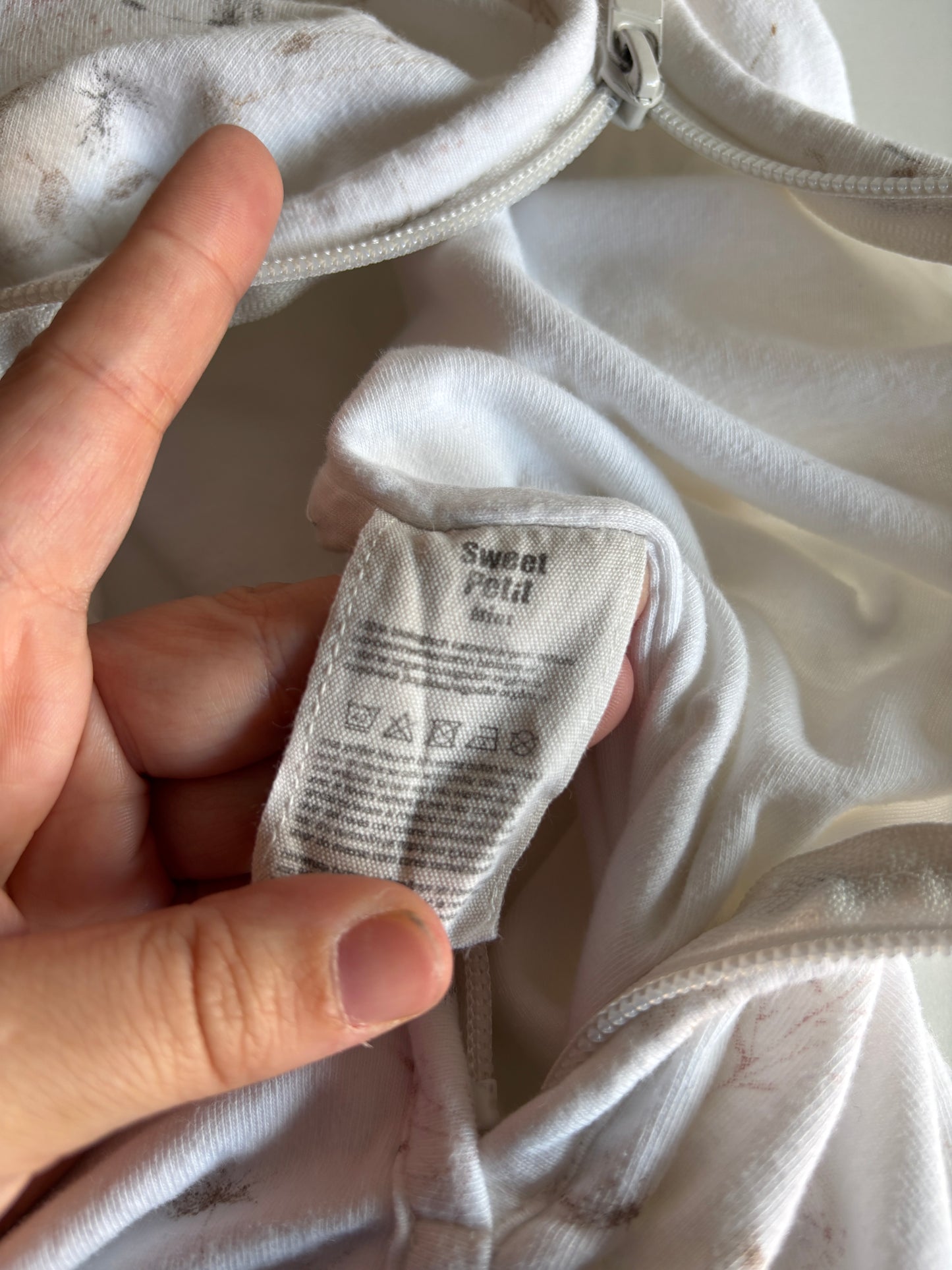 Witte slaapzak met bloemen