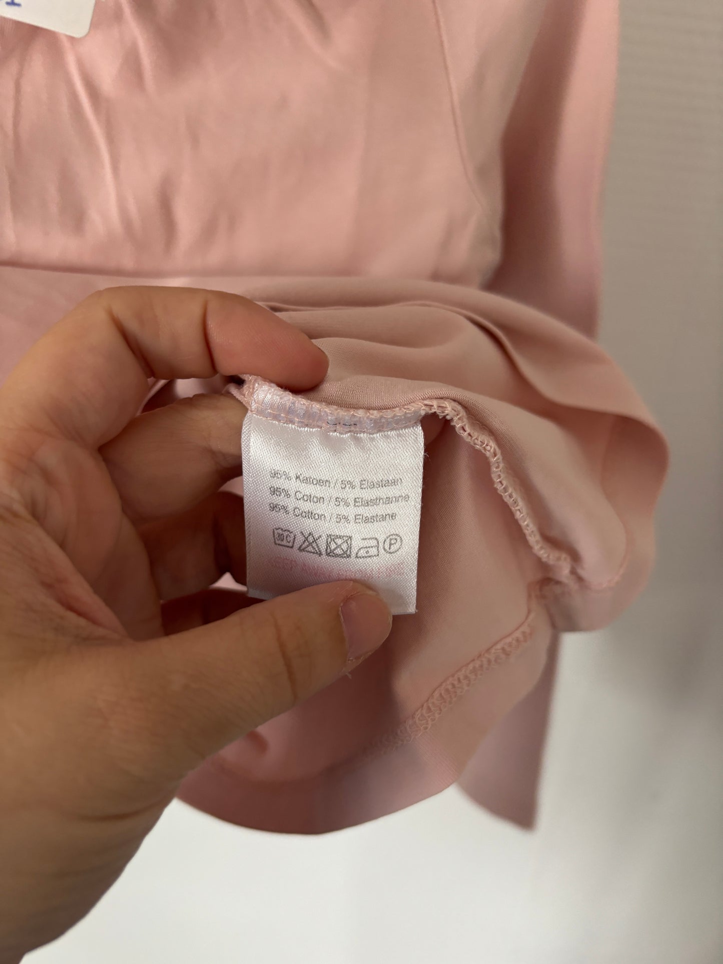 Lichtroze longsleeve met rolkraag