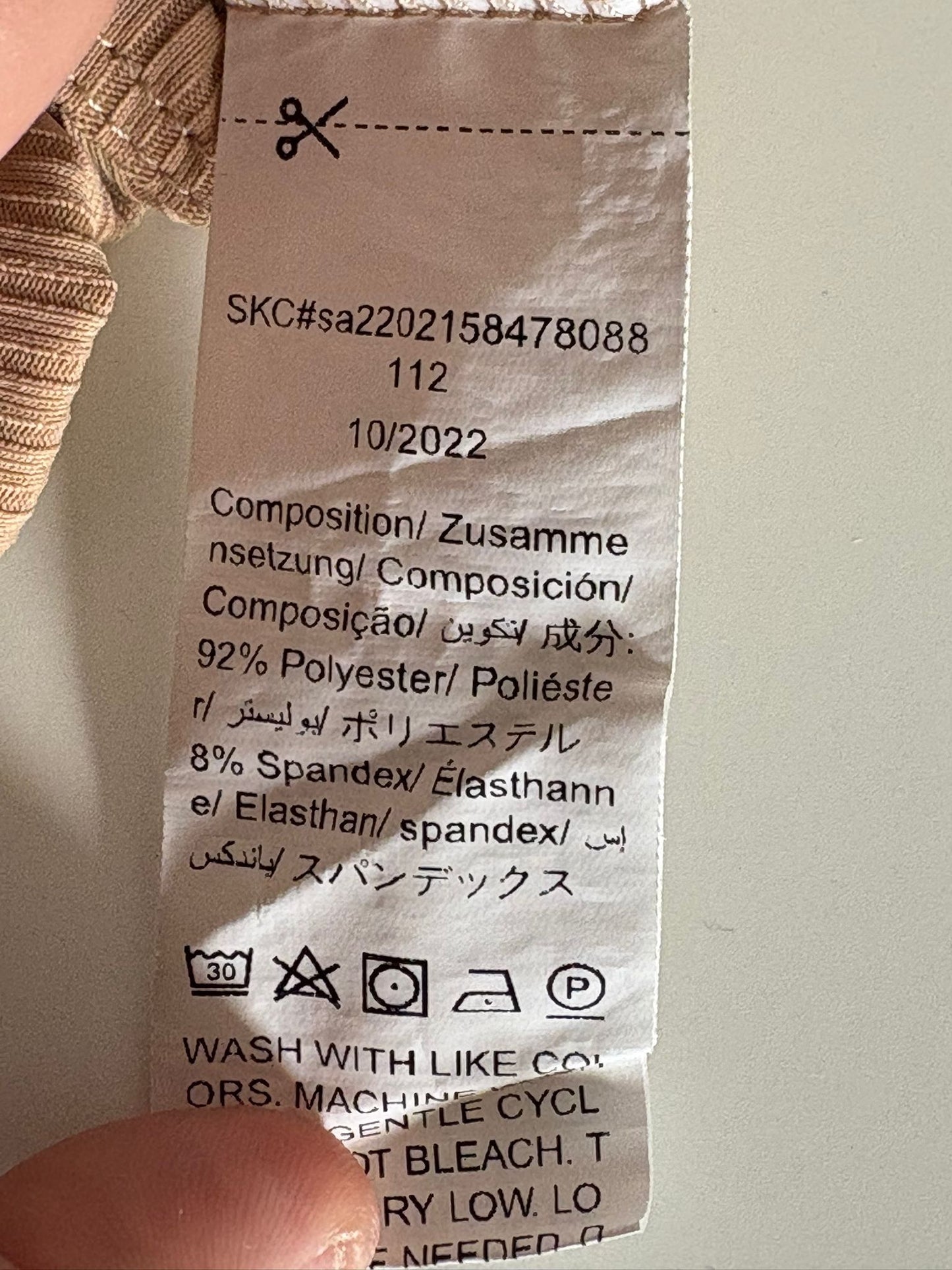 Beige romper met korte mouwen "First I need milk"