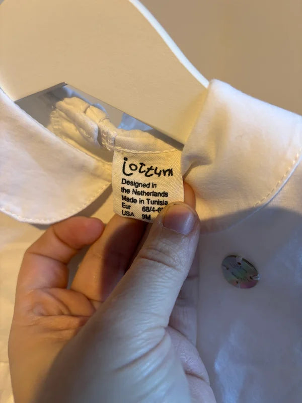 Wit jurkje met lange mouwen