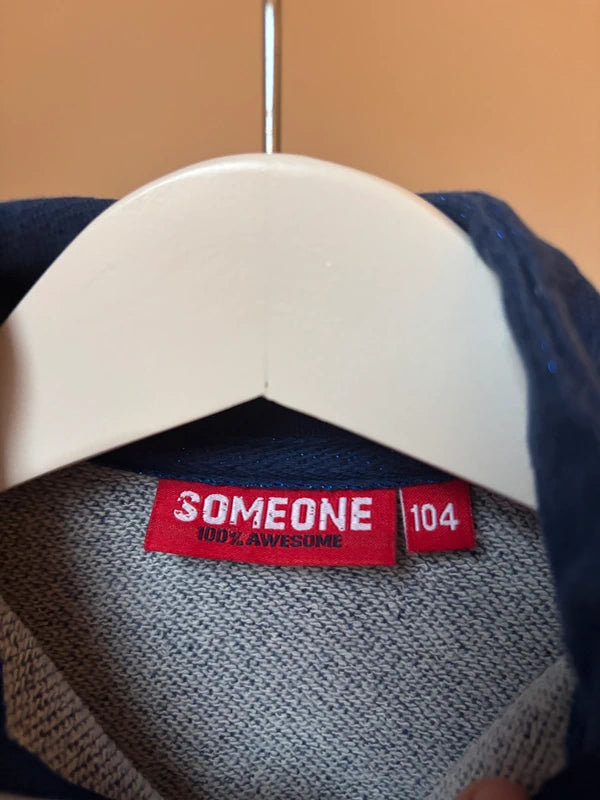 Blauwe vest met glitterdraad