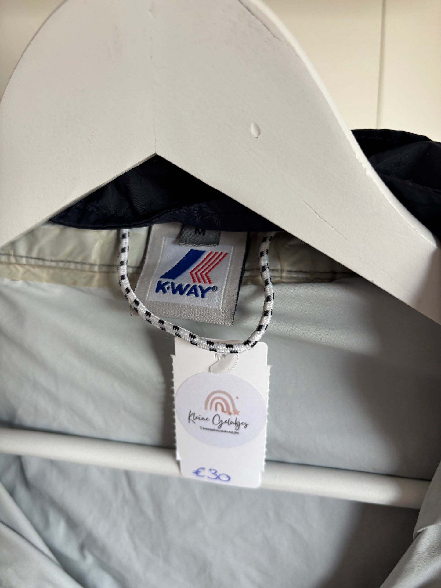 Marineblauwe regenjas