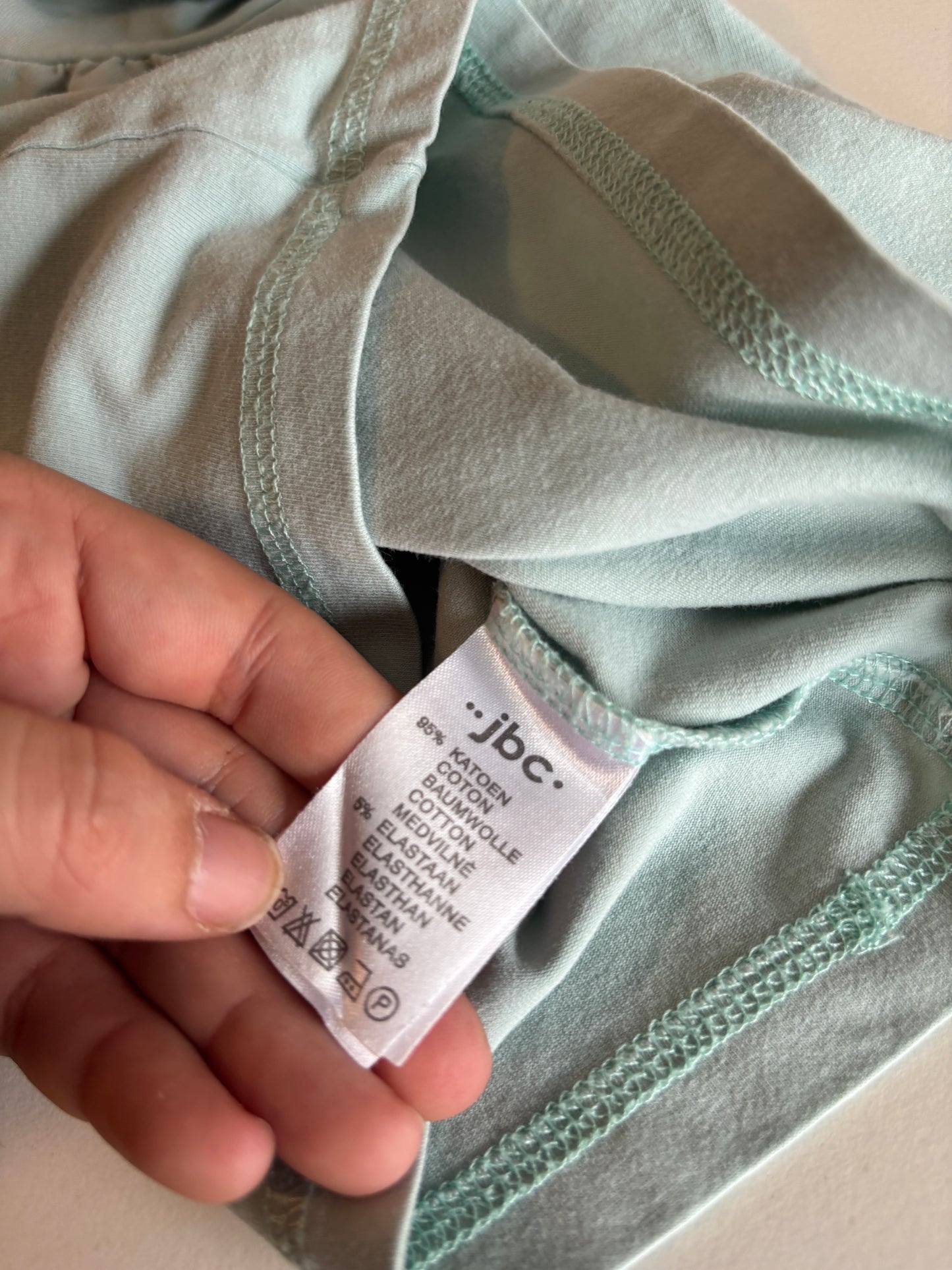 Muntgroene longsleeve met rolkraag