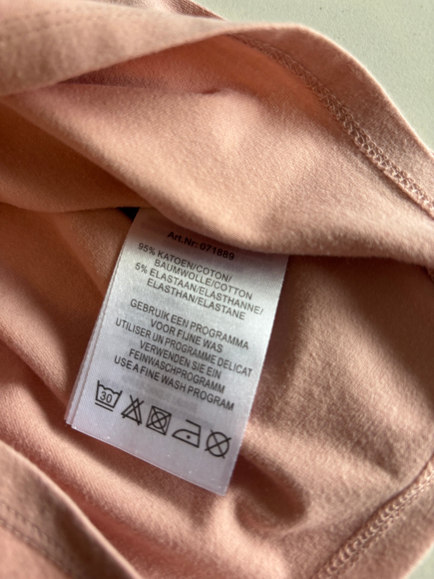 Lichtroze longsleeve met rolkraag