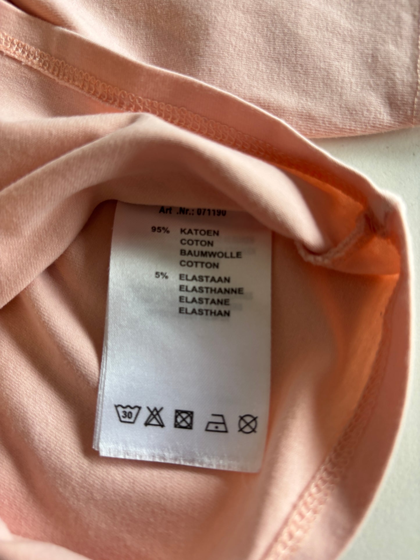 Lichtroze longsleeve met rolkraag