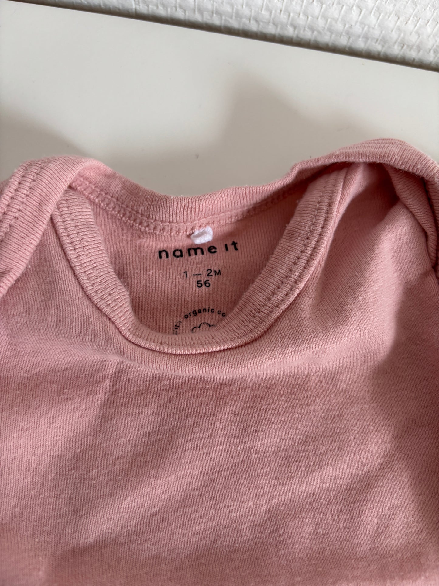 Roze romper met korte mouwen