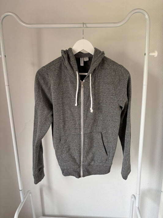 Grijze vest met capuchon