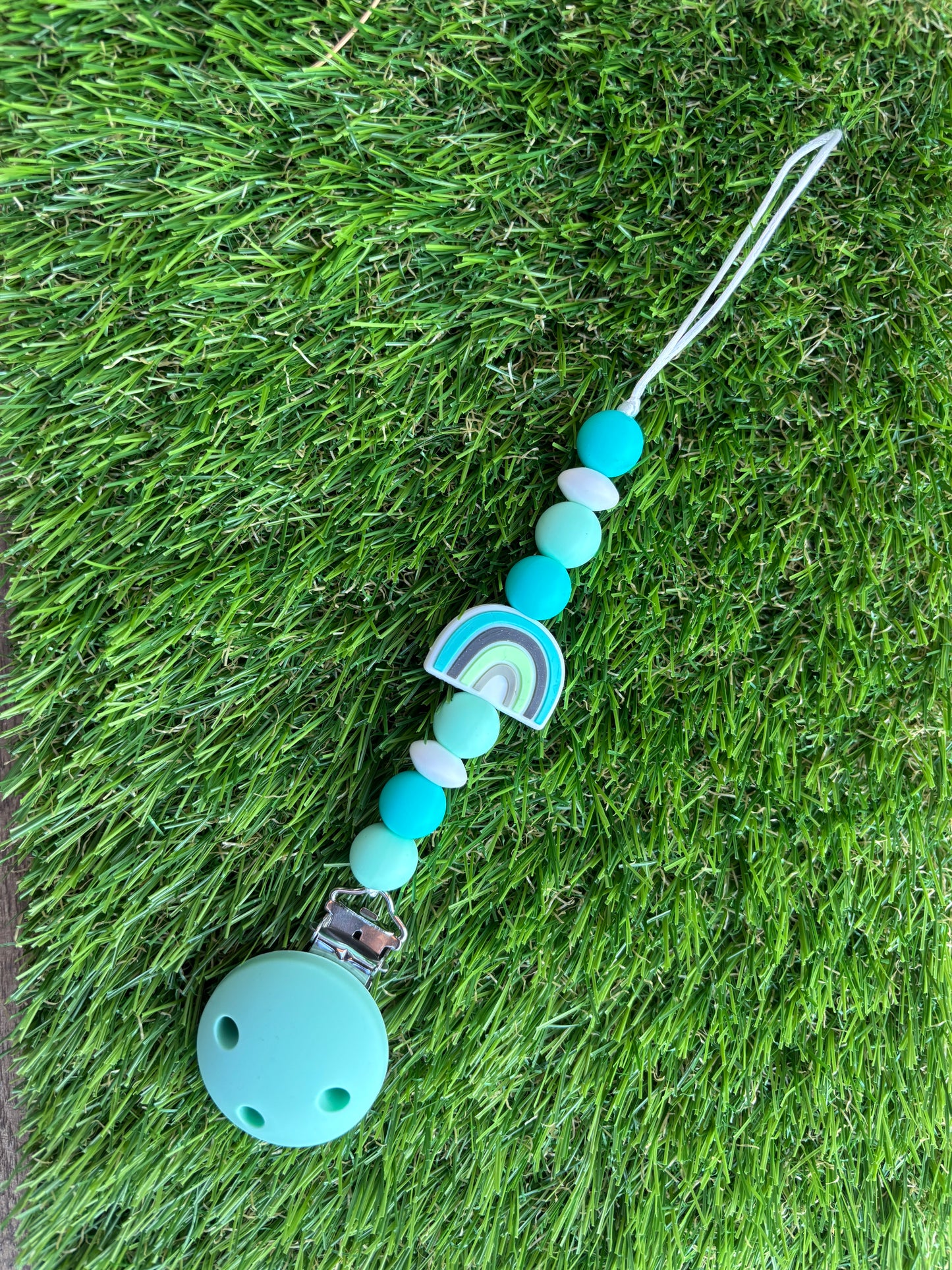 Muntgroene speenkoord met regenboog