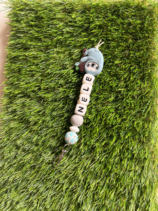 Sleutelhanger met naam, minimusketonhaak en figuurtje