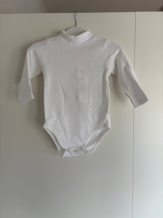 Witte romper met lange mouwen en rolkraag