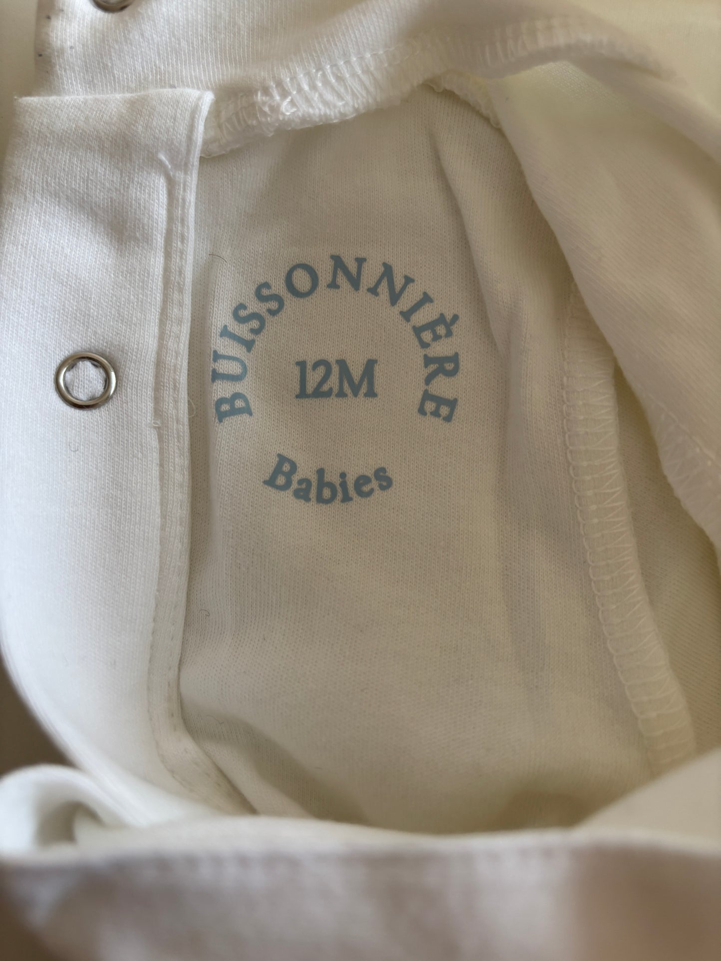 Witte romper met lange mouwen en rolkraag