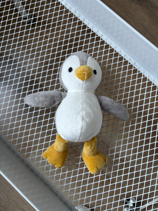 Grijze pinguin met belletje