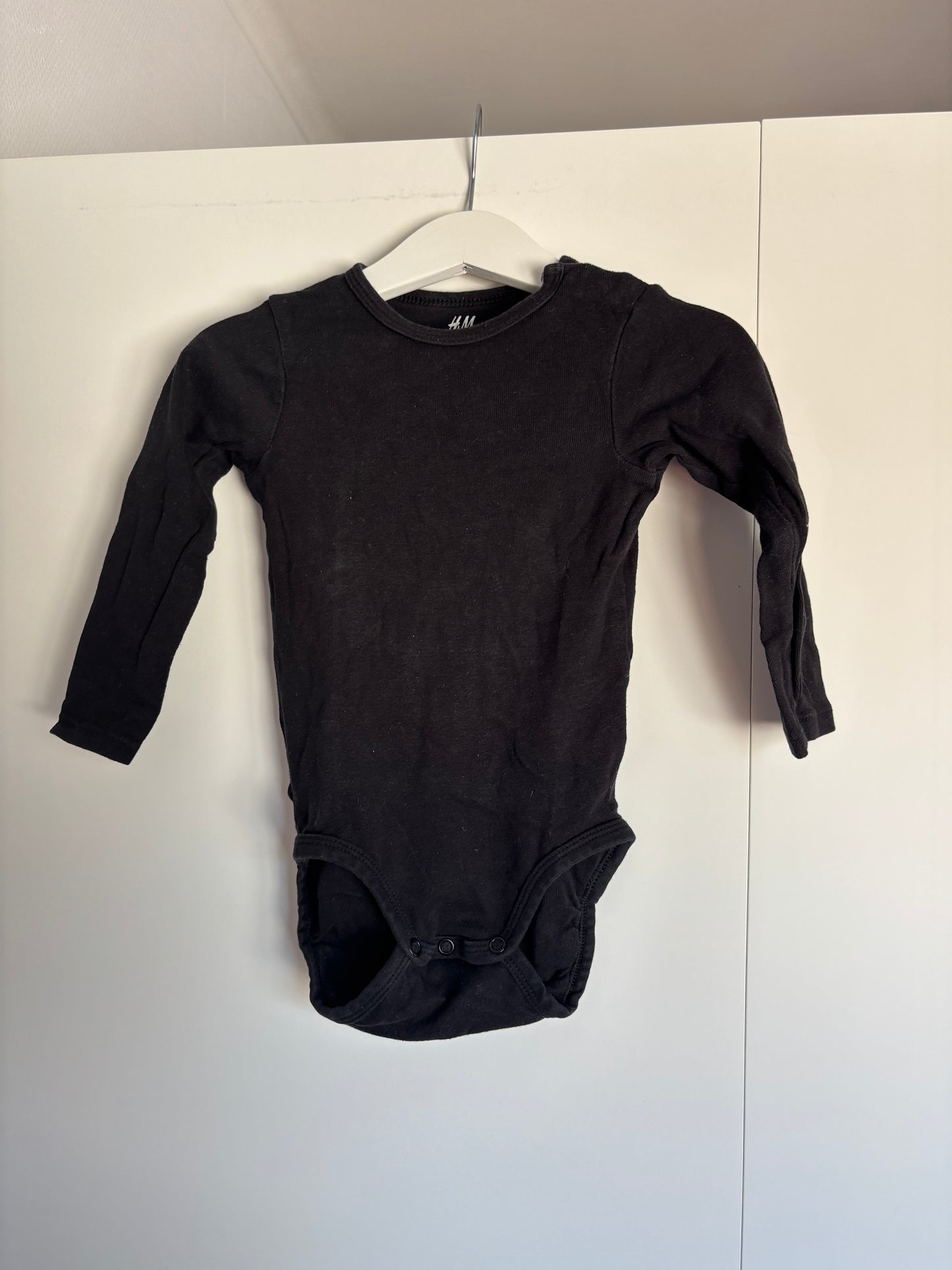 Zwarte romper met lange mouwen