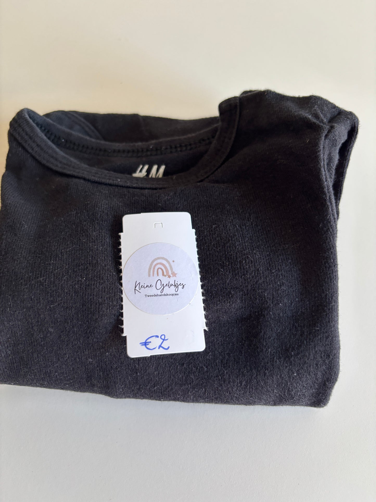 Zwarte romper met lange mouwen