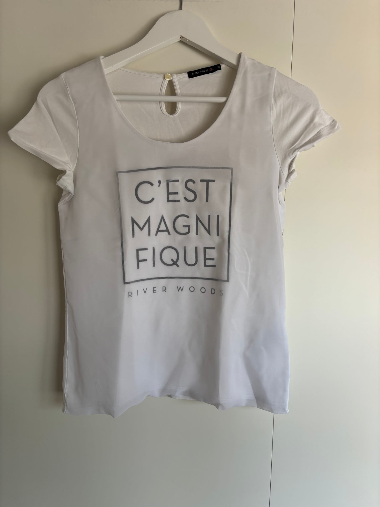 Witte T-shirt "C'est magnifique"
