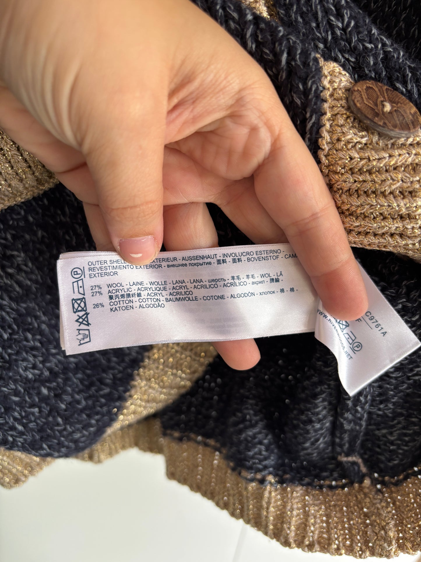 Marineblauwe cardigan met gouden rand