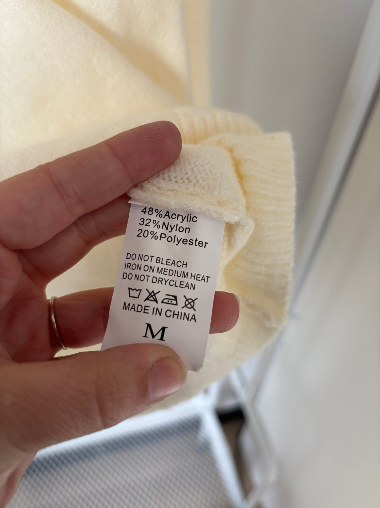 Crèmekleurige coltrui