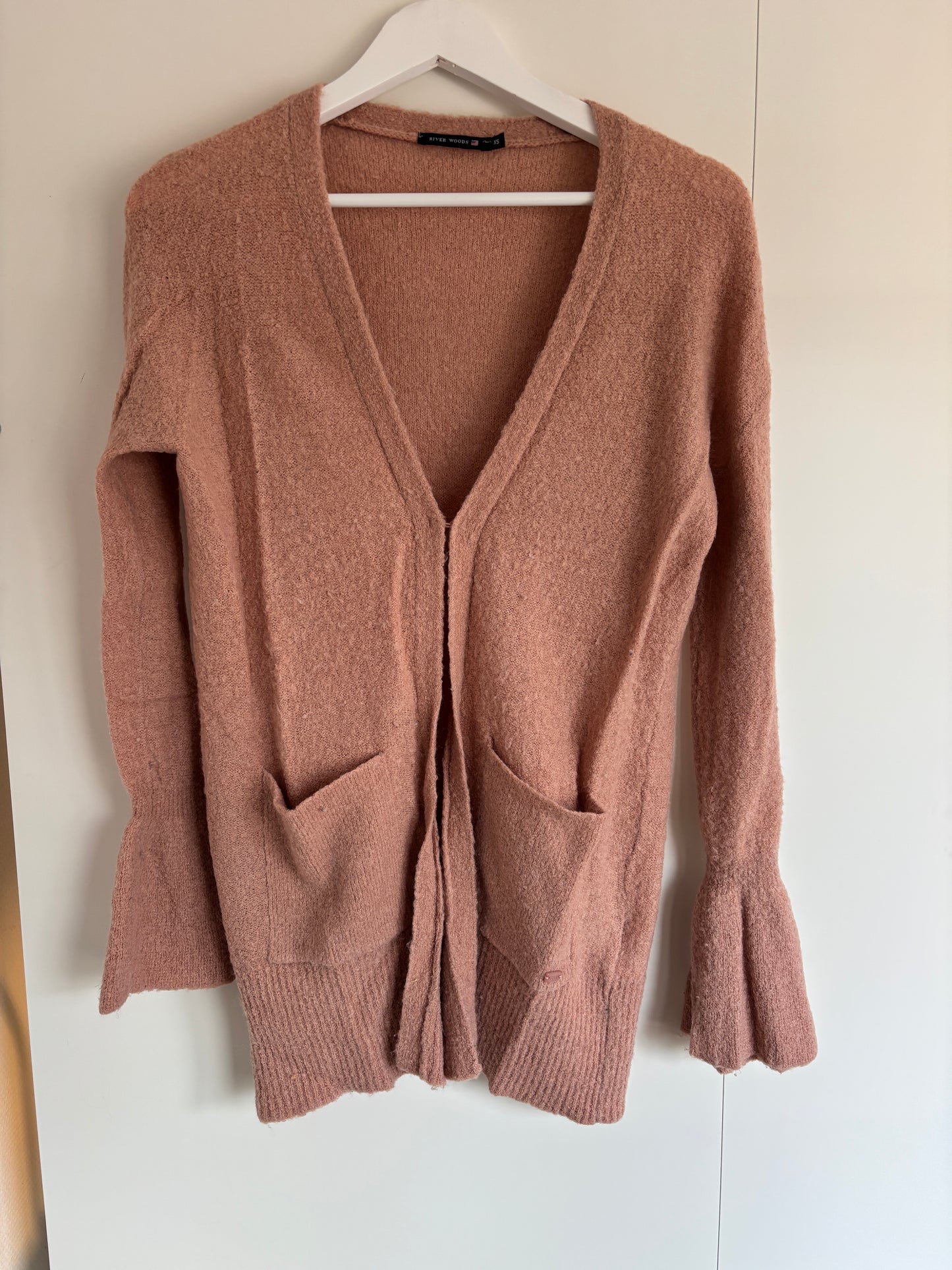 Roze vest met knoopje