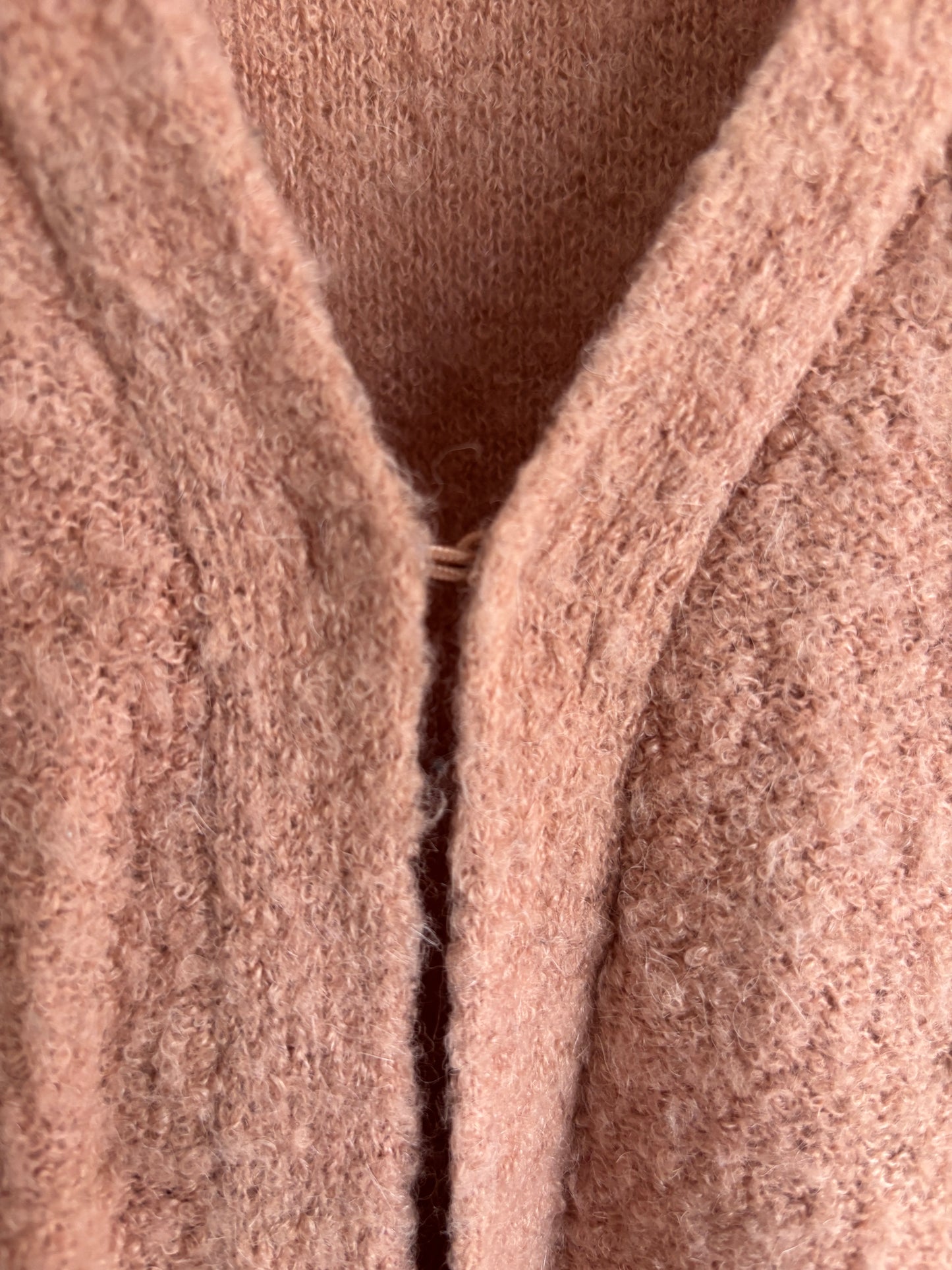 Roze vest met knoopje