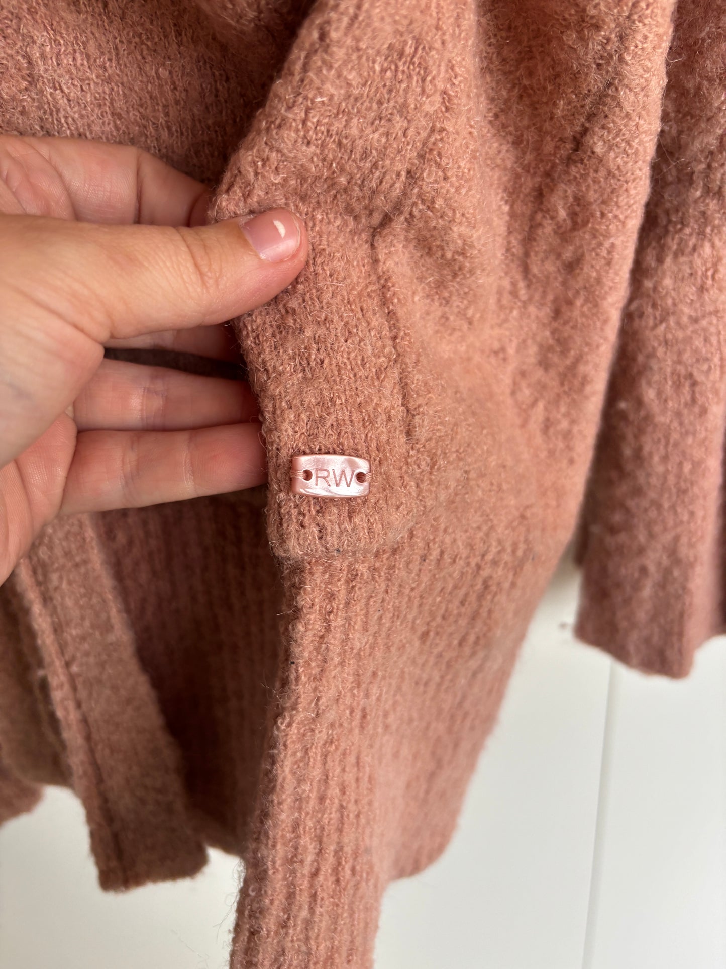 Roze vest met knoopje