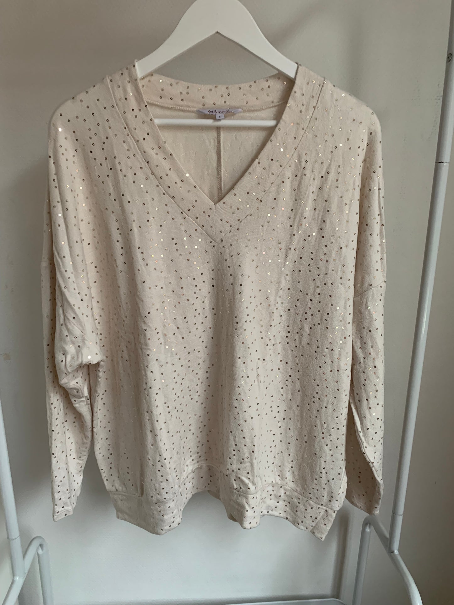 Witte blouse met gouden glitters