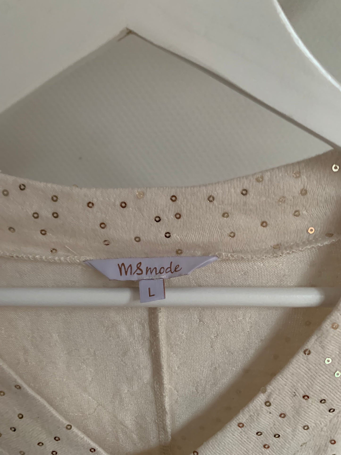Witte blouse met gouden glitters