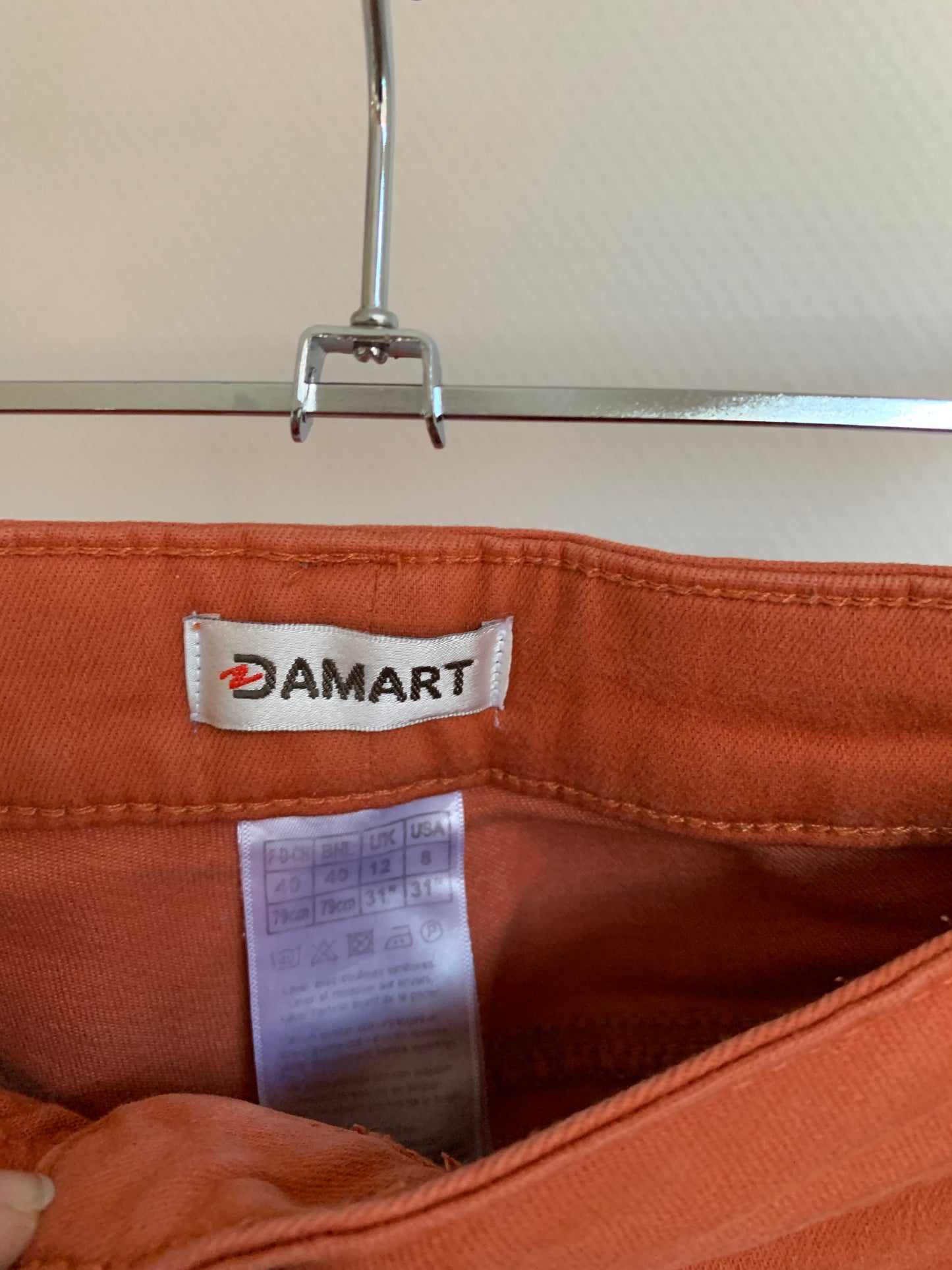 Oranje/roestkleurige jeansbroek