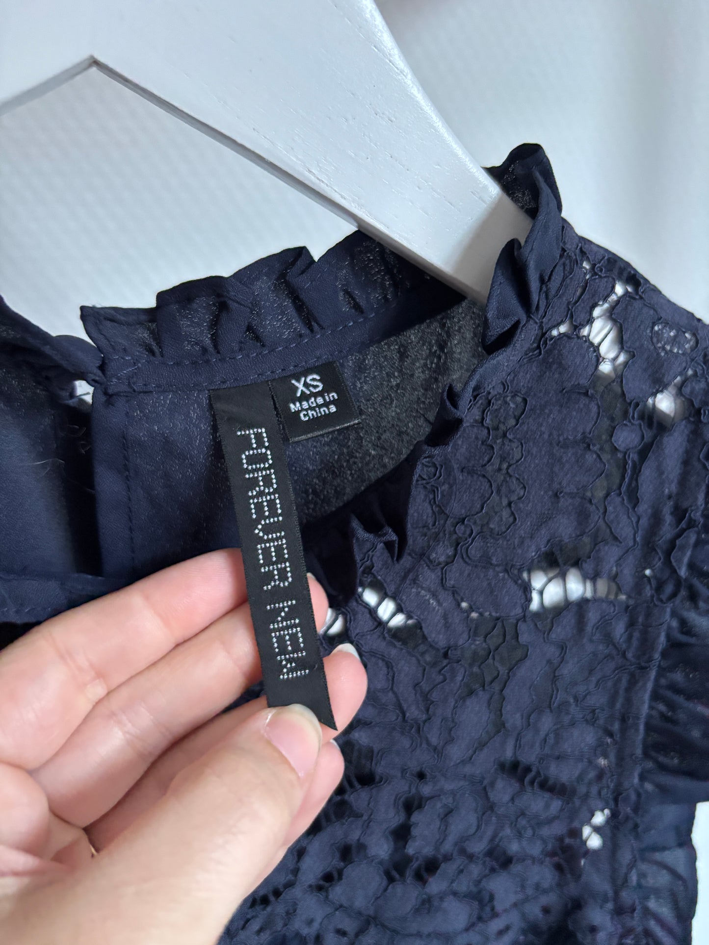 Marineblauwe mouwloze blouse