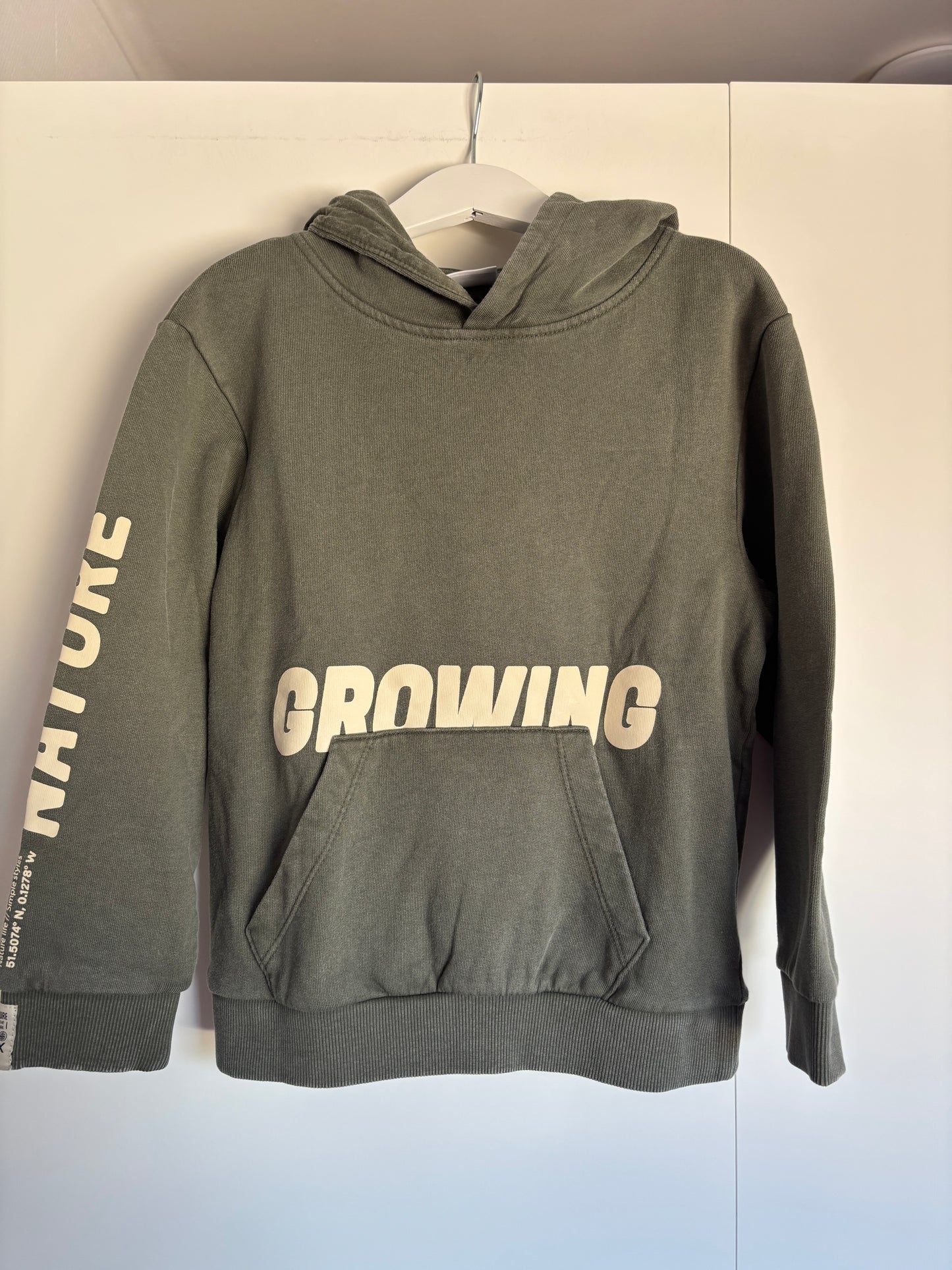 Donkergroene sweater "Growing"