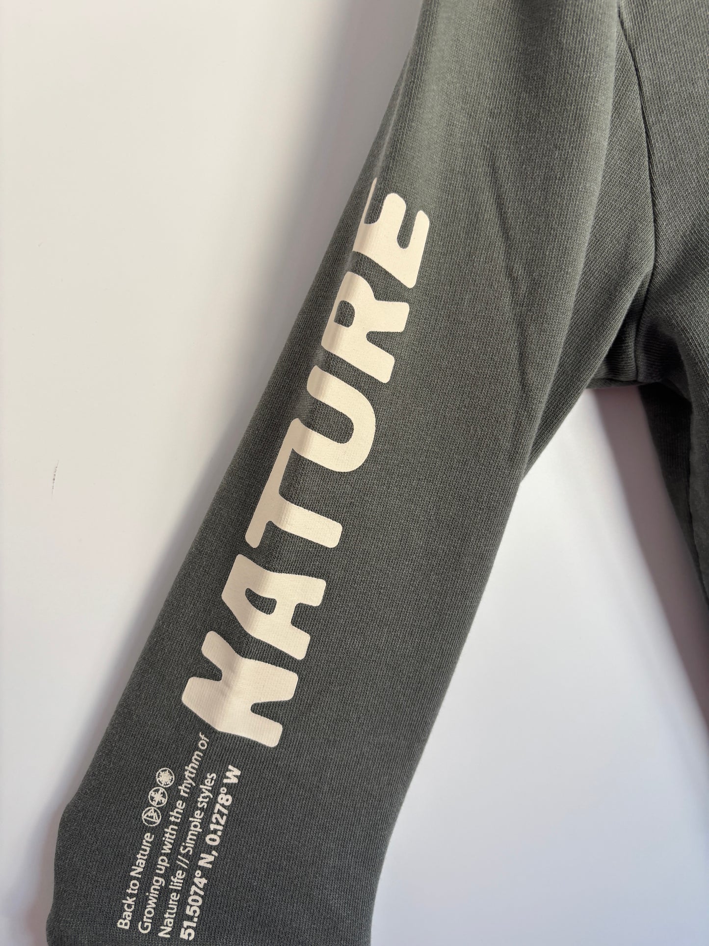 Donkergroene sweater "Growing"