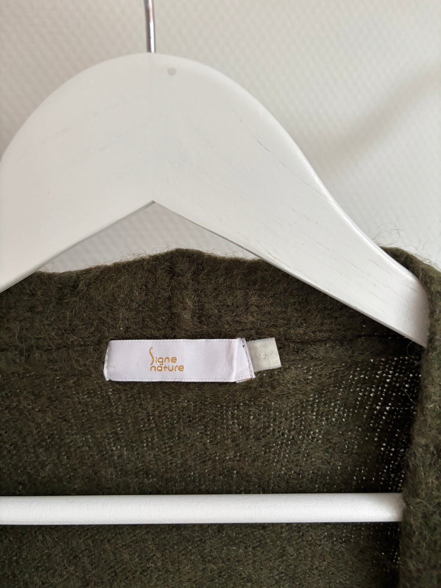 Donkergroene vest met gouden boord