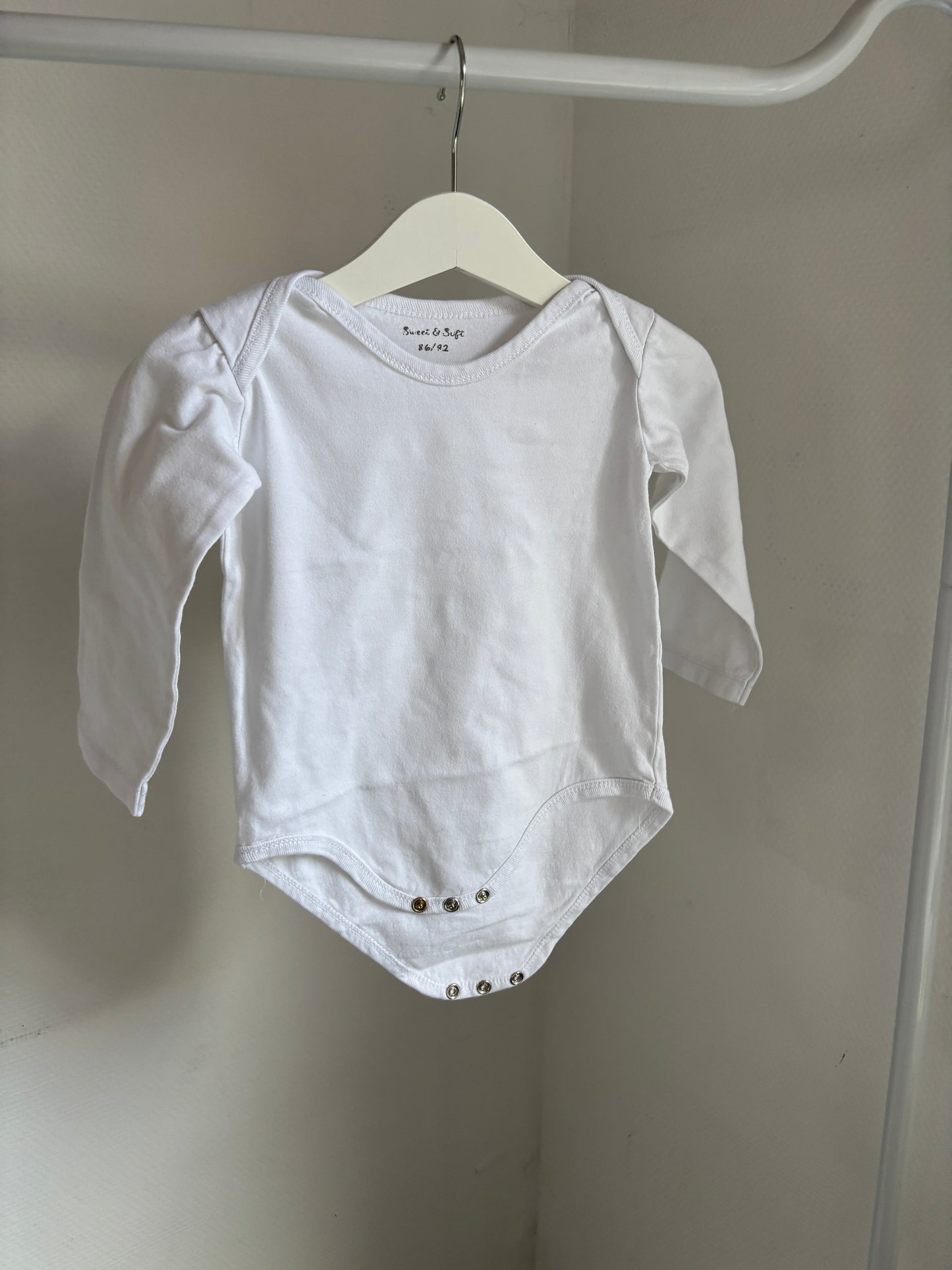 Witte romper met lange mouwen