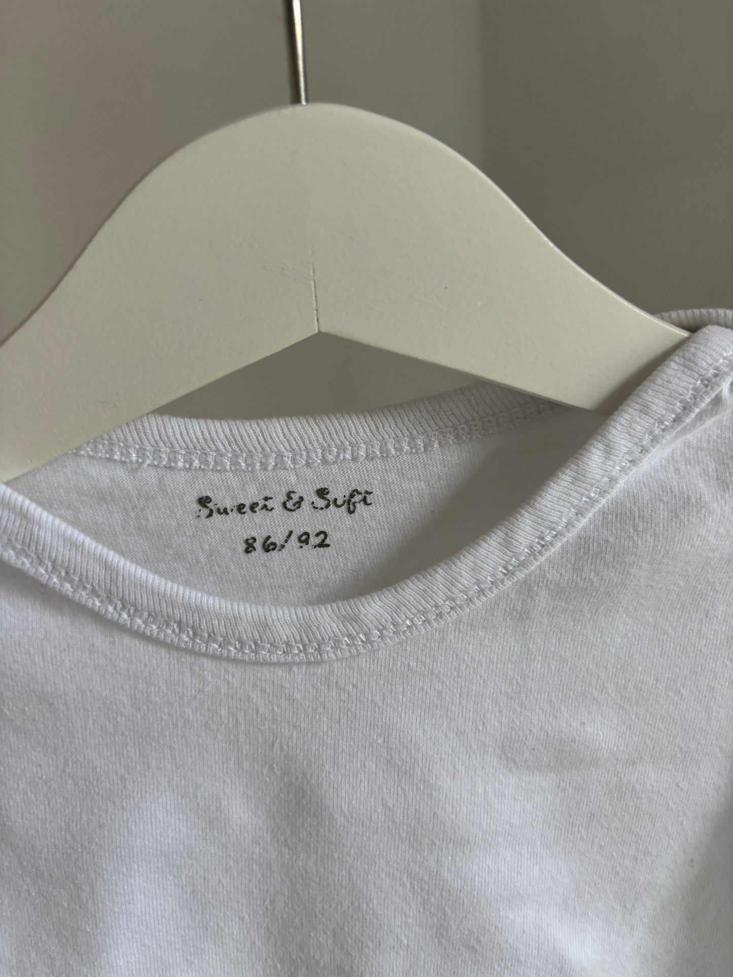 Witte romper met lange mouwen