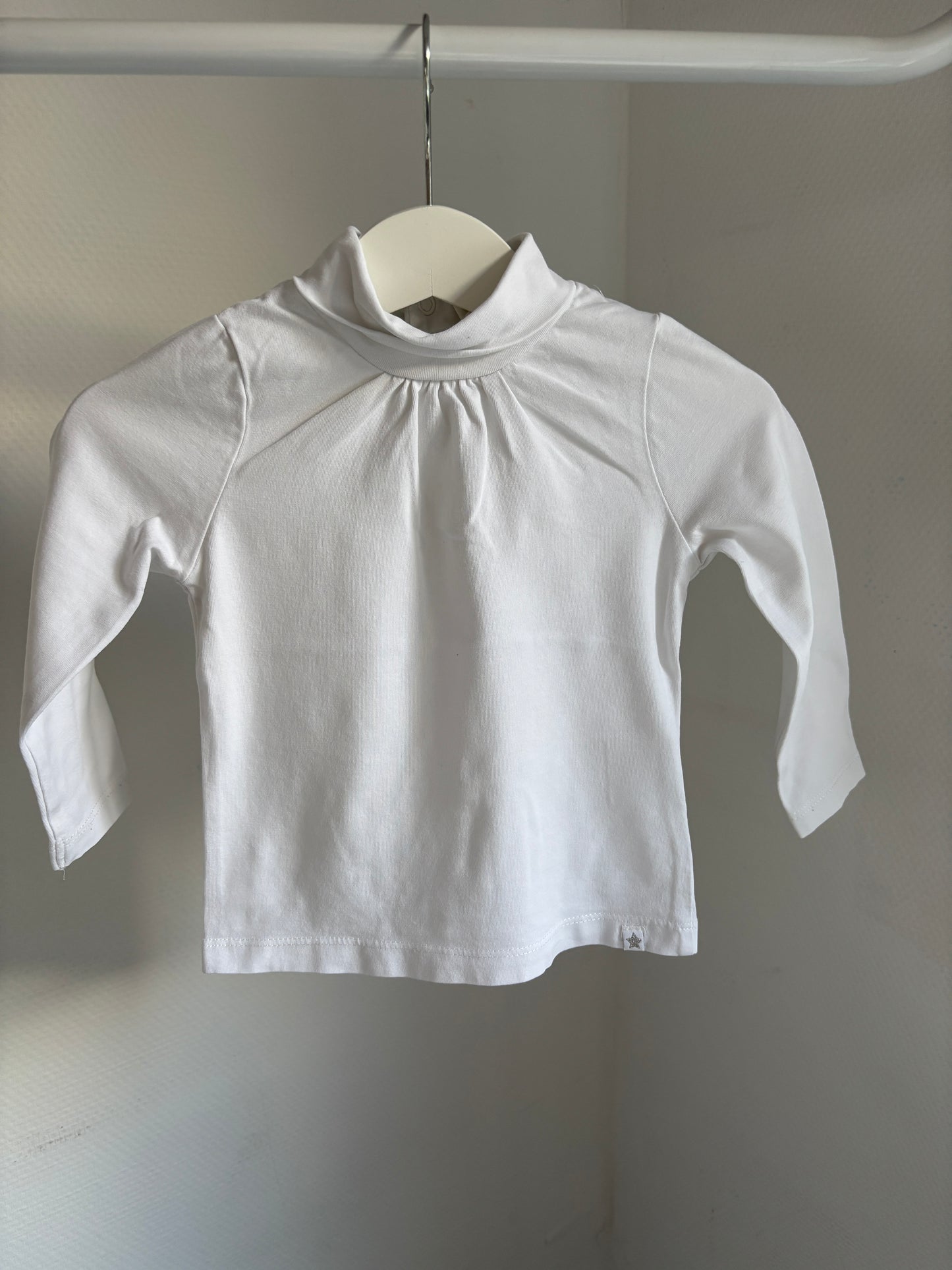 Witte longsleeve met rolkraag