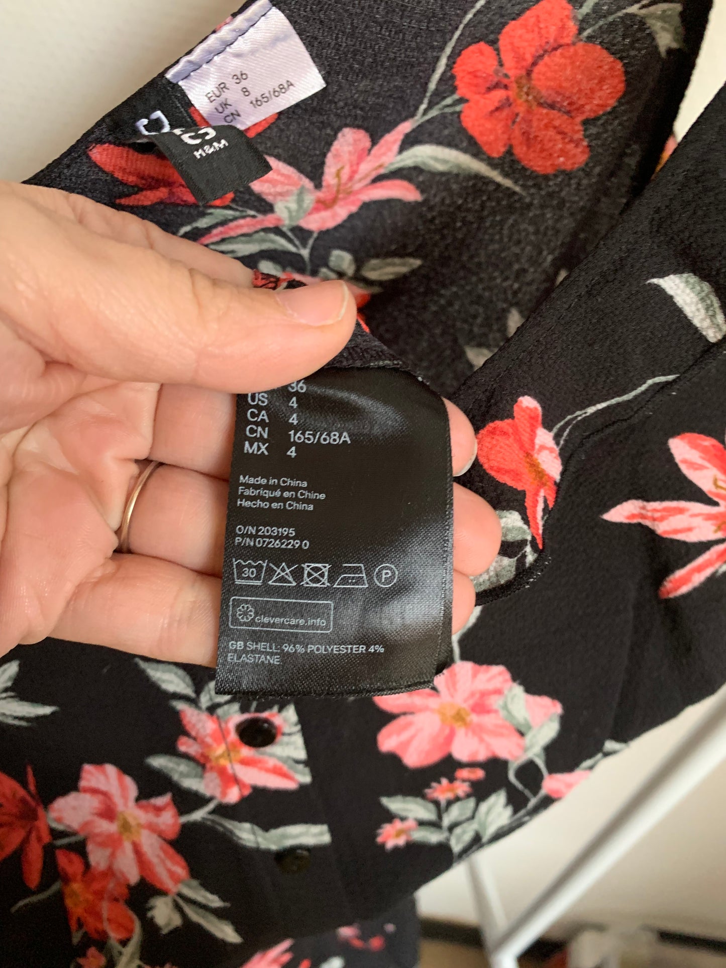 Zwarte jumpsuit met roze bloemen