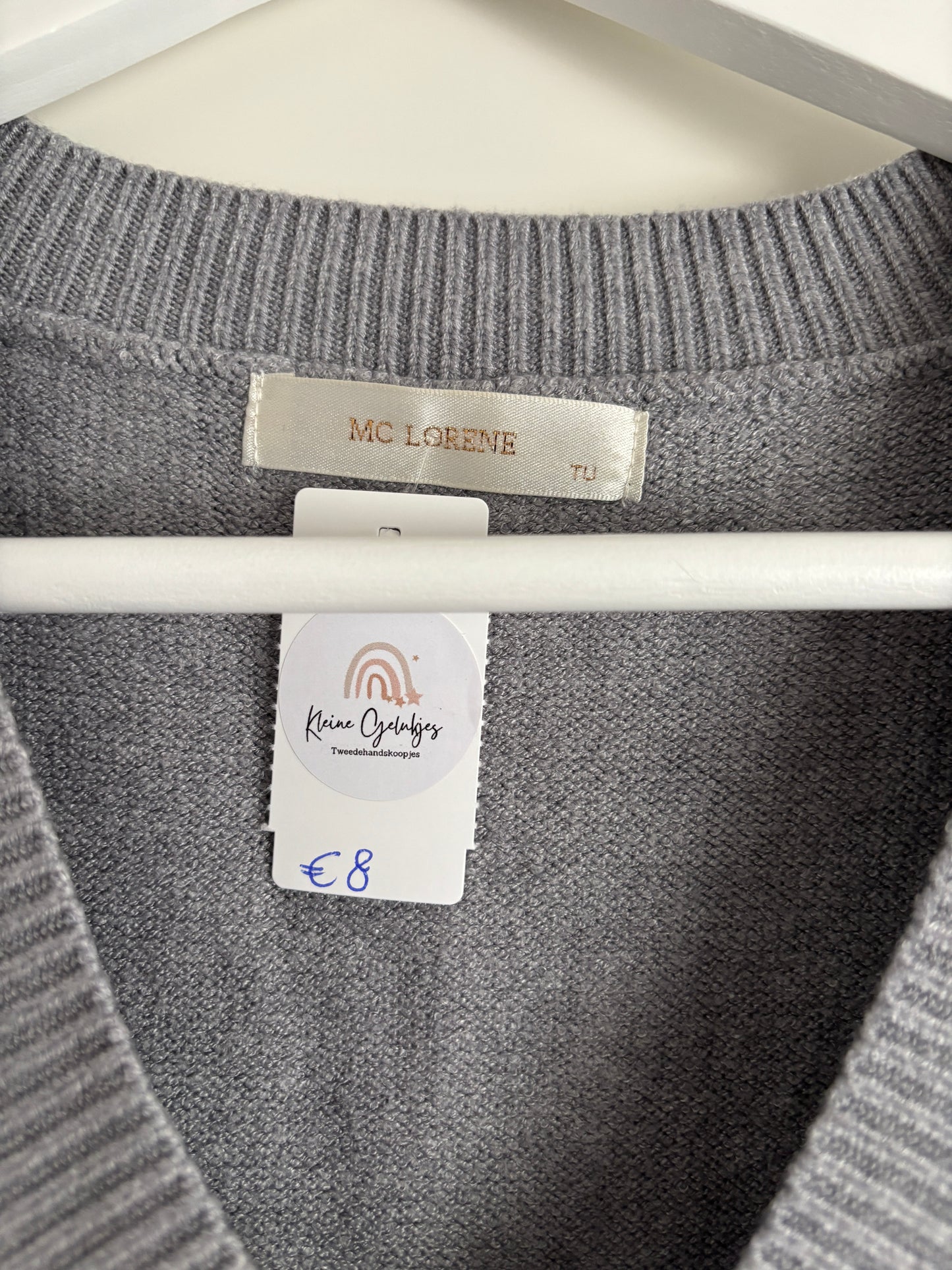 Grijze trui zonder mouwen