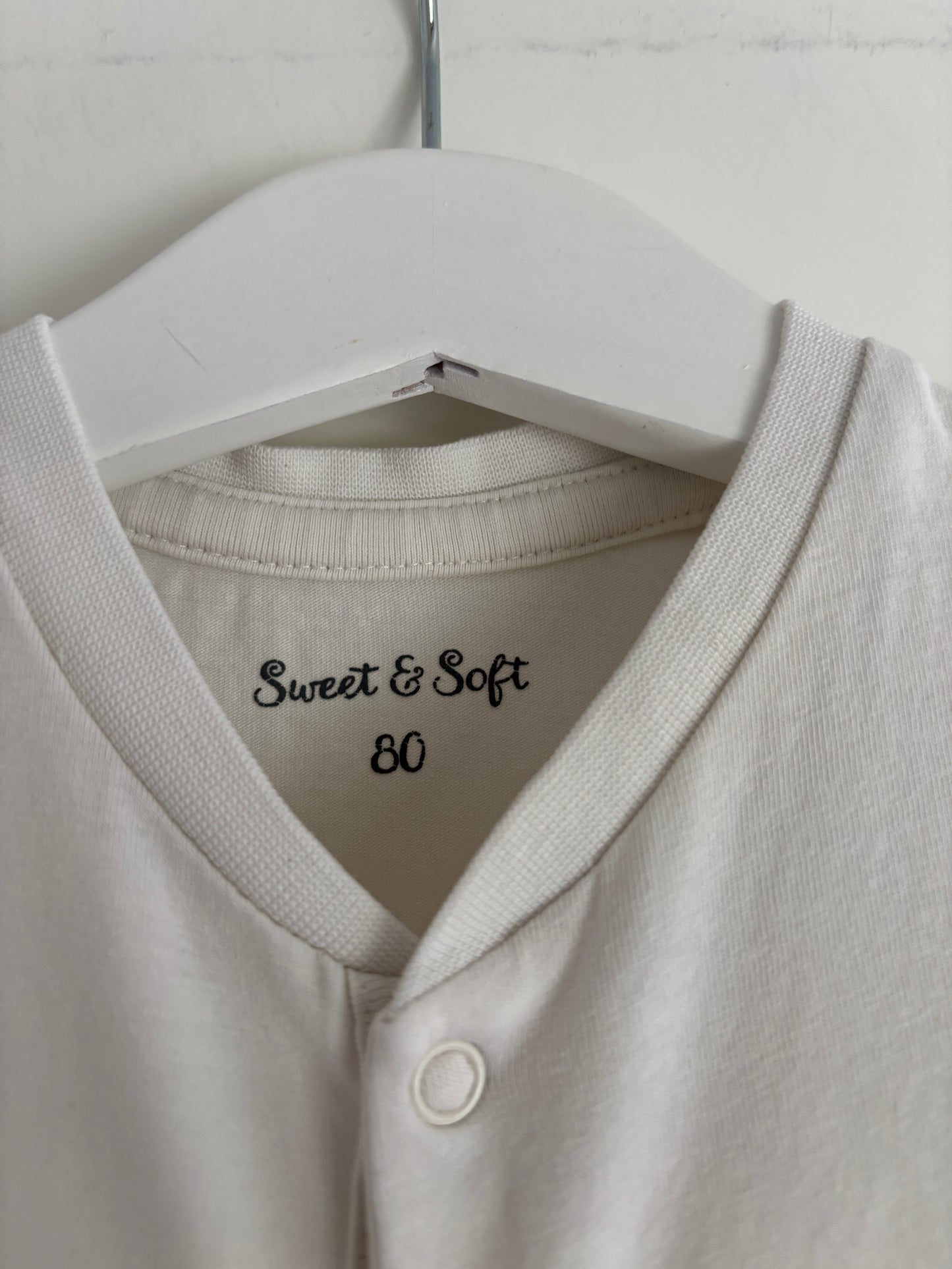 Crèmekleurige eendelige pyjama