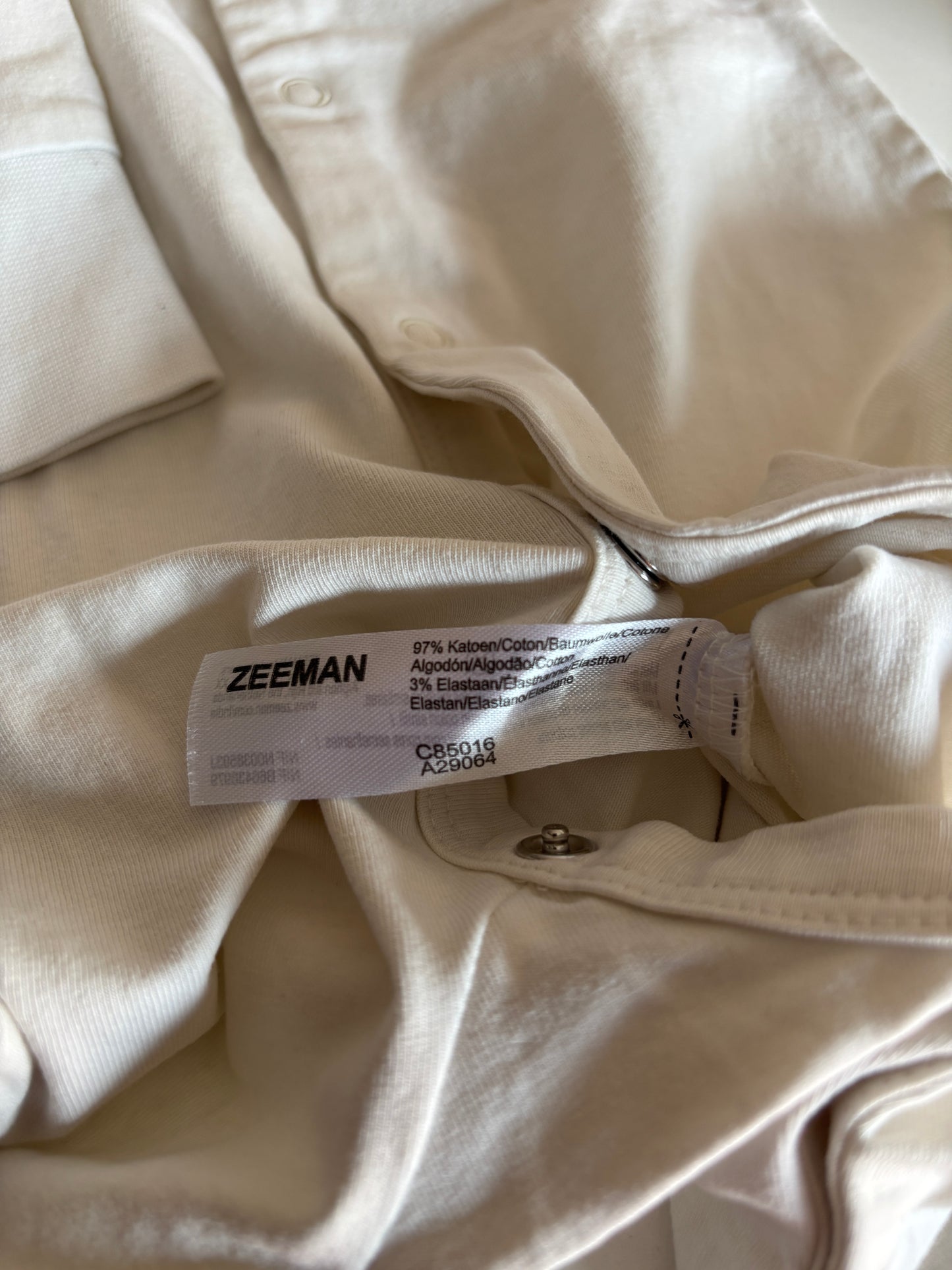 Crèmekleurige eendelige pyjama