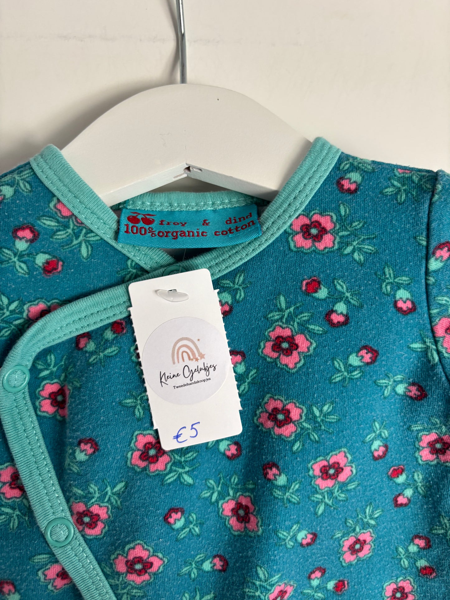Turquoise eendelige pyjama met bloemetjes