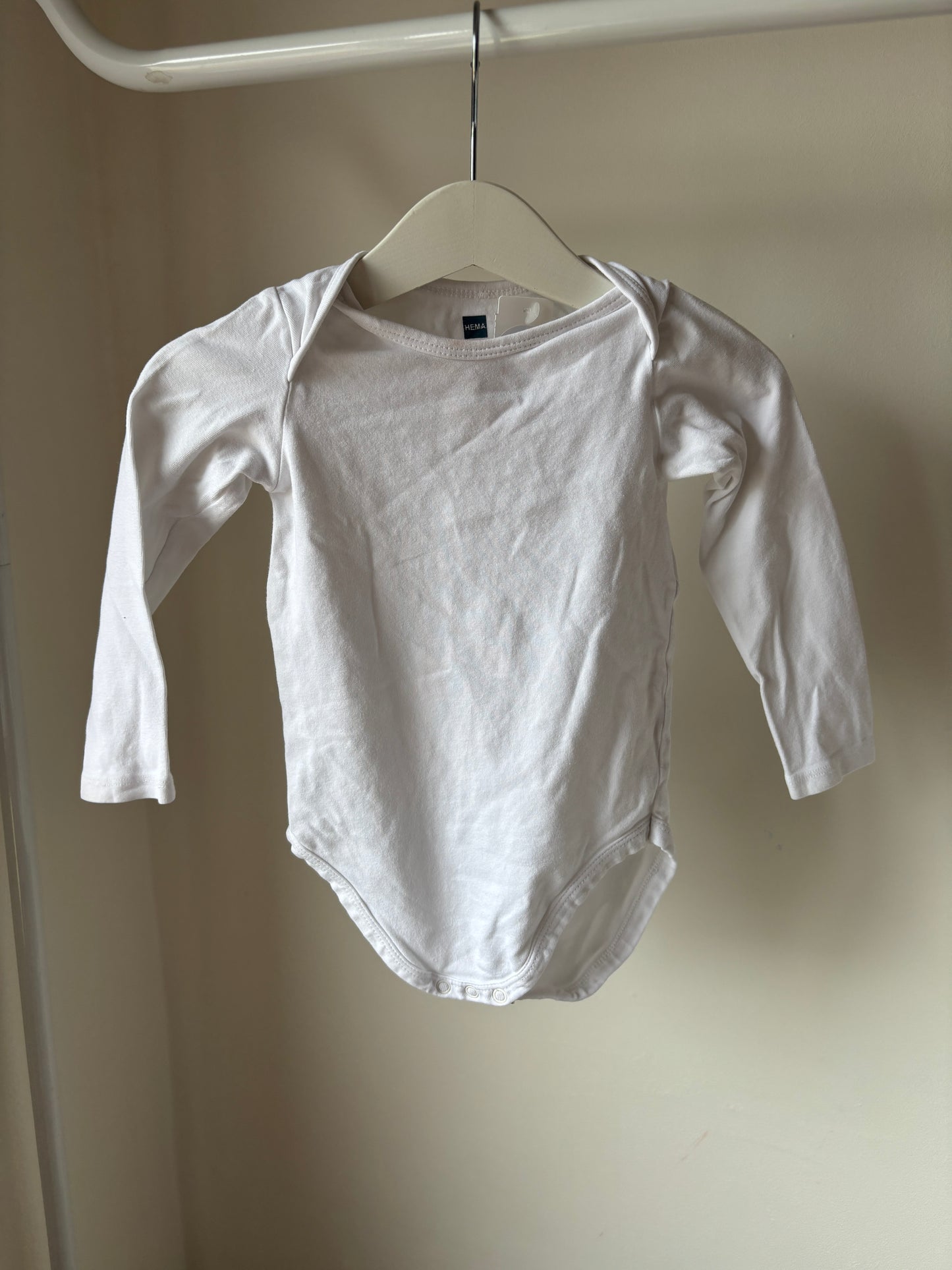 Witte romper met lange mouwen