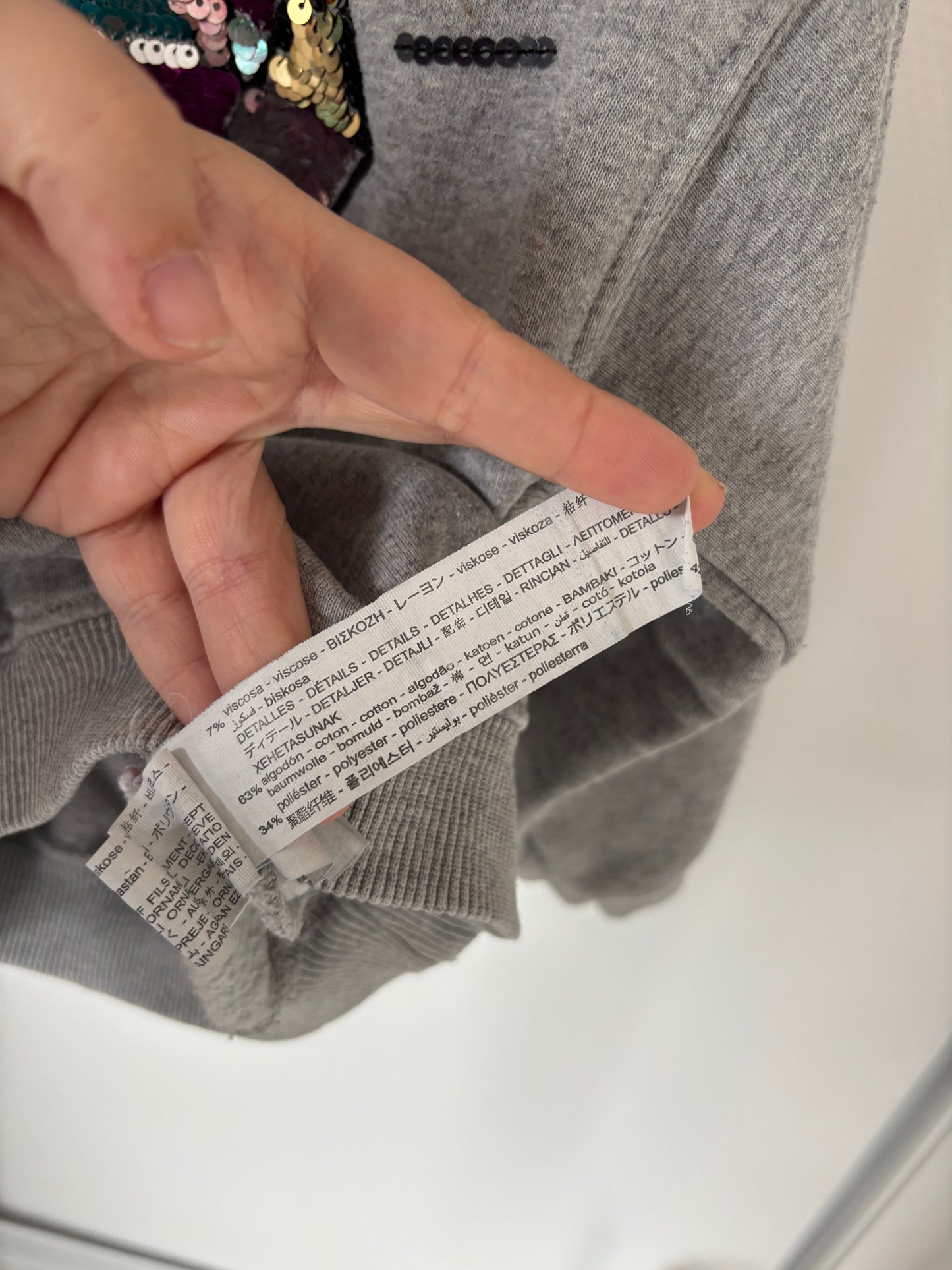 Grijze sweater met diamant