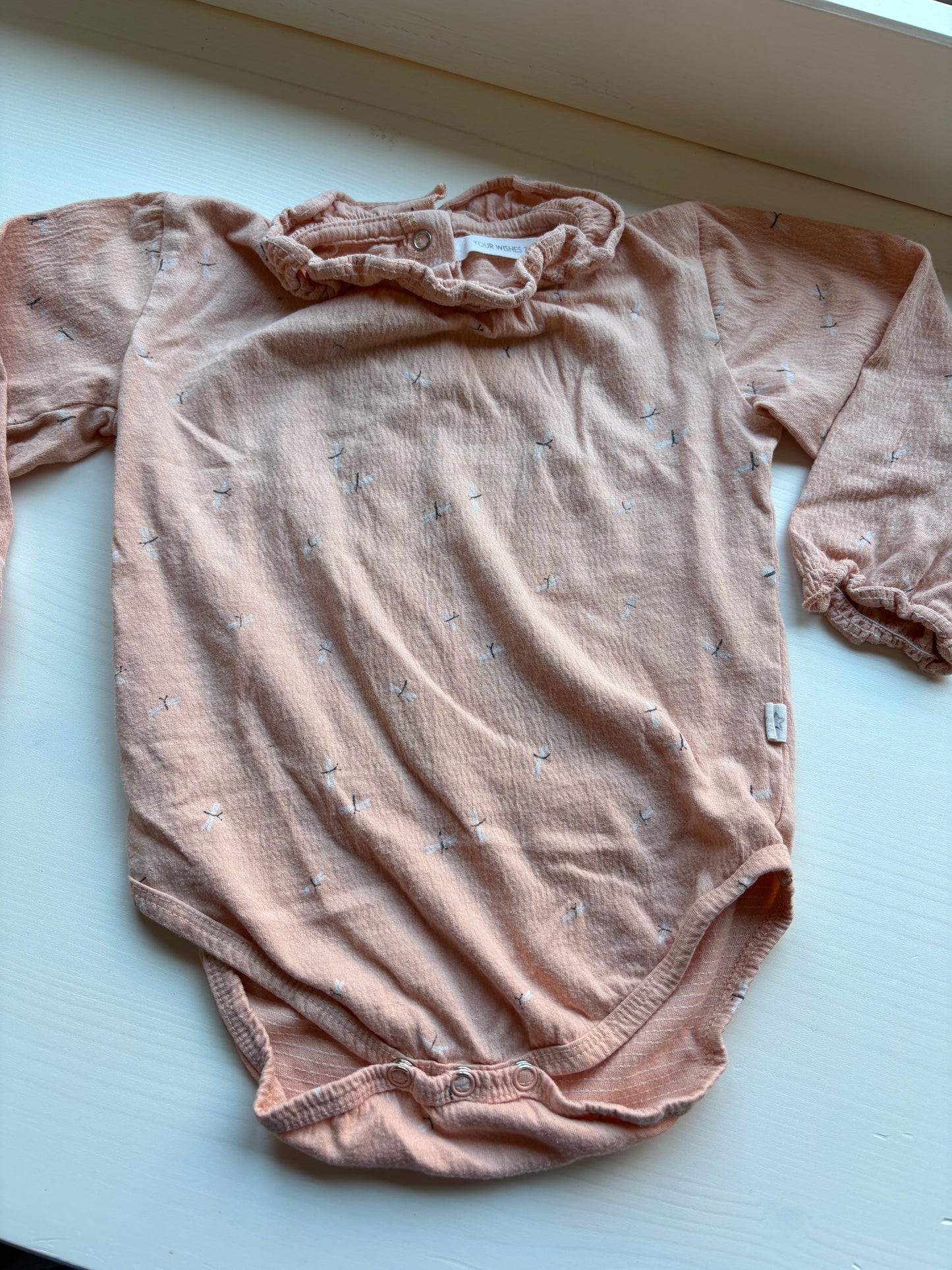 Pasteloranje romper met lange mouwen