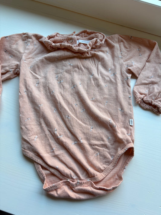 Pasteloranje romper met lange mouwen