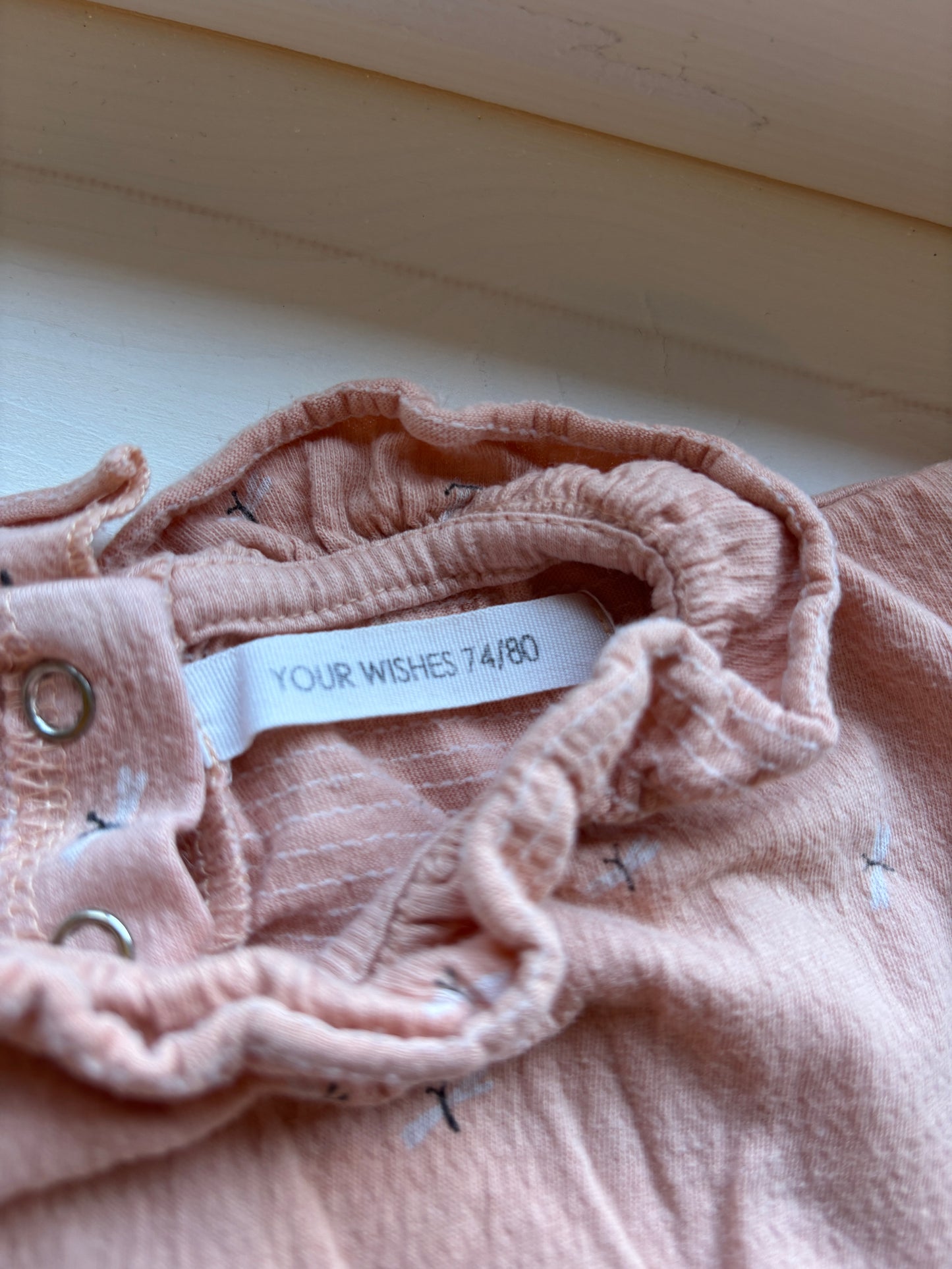 Pasteloranje romper met lange mouwen