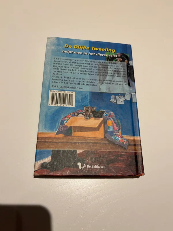 Marion van de Coolwijk - De Olijke Tweeling helpt mee in het dierenasiel